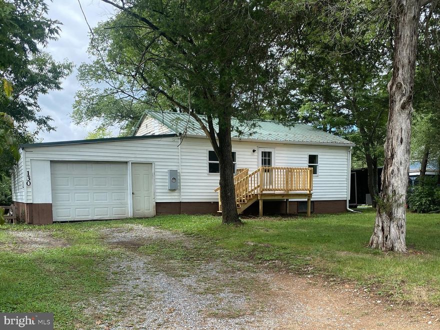 “TURN THIS PLAIN JANE INTO A COUNTRY CHARMER”
A little TLC and this will be a darling little home. Excellent starter or investment. Add some landscaping and a few touches to the exterior and fall in love. So much potential!!!! 2 nice size bedrooms, large bath. Well and septic so no water and sewer bills!!! Big laundry room for washing, sorting and hanging clothes. Just add a table and rod, Huge yard perfect for the growing family and pet lovers! Excellent location for locals and commuters! 
Enclose the utilities in the basement then drywall and enjoy a kids/adult playroom or man cave! Drywall or paint the garage..... seal the floor. Great room for a tool bench in back of garage. So many possibilities to make this a charming home, the ideas are endless.