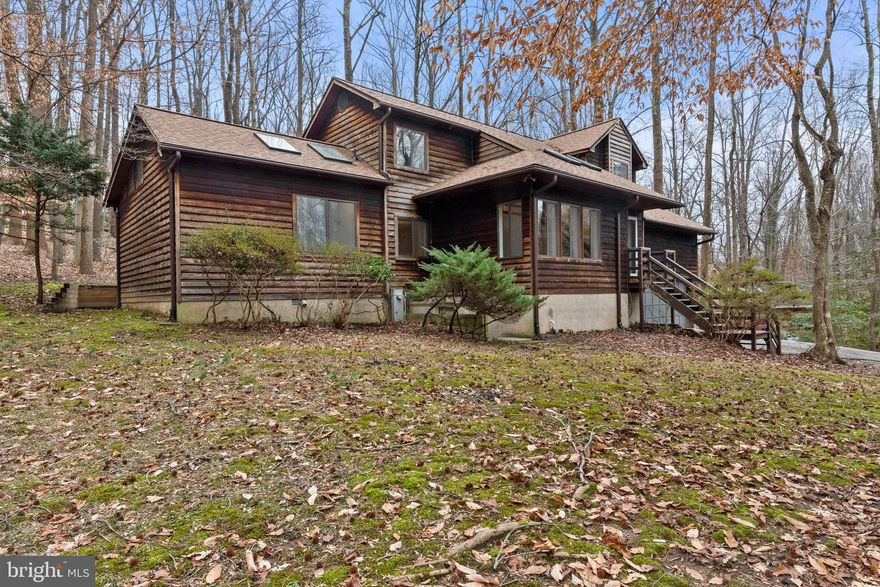 This is Valentine Creek! Small private neighborhood close to everything. Cul-de-sac location tucked back in the woods. Beautiful, peaceful and private location. The home has many recent renovations ready for you to move in!  Handsome Brazilian Cherry hardwood as you walk in  and carries through the dining room. Living room has a newer sliding door and cozy wood stove. Country kitchen with several new stainless steel appliances. Freshly painted interior and new flooring installed in bedrooms, kitchen and hallway. Large main level primary suite with glass ceiling and a wall of windows welcoming nature to your day. Also a huge ensuite ready for some final touches. Second floor boasts three bedrooms and two full baths, both renovated. One second floor bedroom with ensuite with walk-in shower. Huge deck off the rear facing a private, approx .84 acre wooded lot. Two car garage with plenty of custom storage. Roof replaced in 2022. Gutter guards and 4 inch downspouts added. Walking trails at the end of the neighborhood.
15 minutes to Annapolis/Rt 50, 10  minutes to Rt97. Smiths Marina only a short drive, less than 5 min.