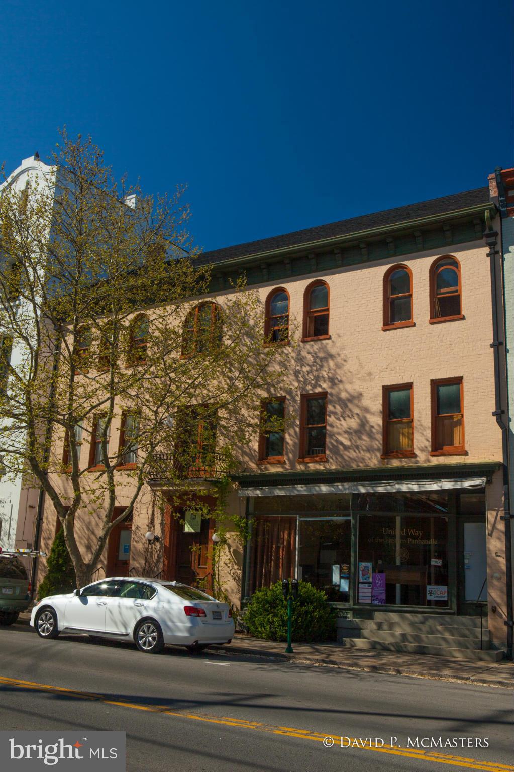 WOW! Gorgeously restored 5700 SF brick mixed use building across fr. Fed Cthouse. Architect/owners restored it, lived in it, now have offices on 2nd/3rd floor while renting 1st. Any/all could be rentals. Asethetically impeccable. All systems modern. See floorplans under "documents". Enjoy the photos. More info at BE8341270. Great for small prof firm or to live + work at home. Great yard.