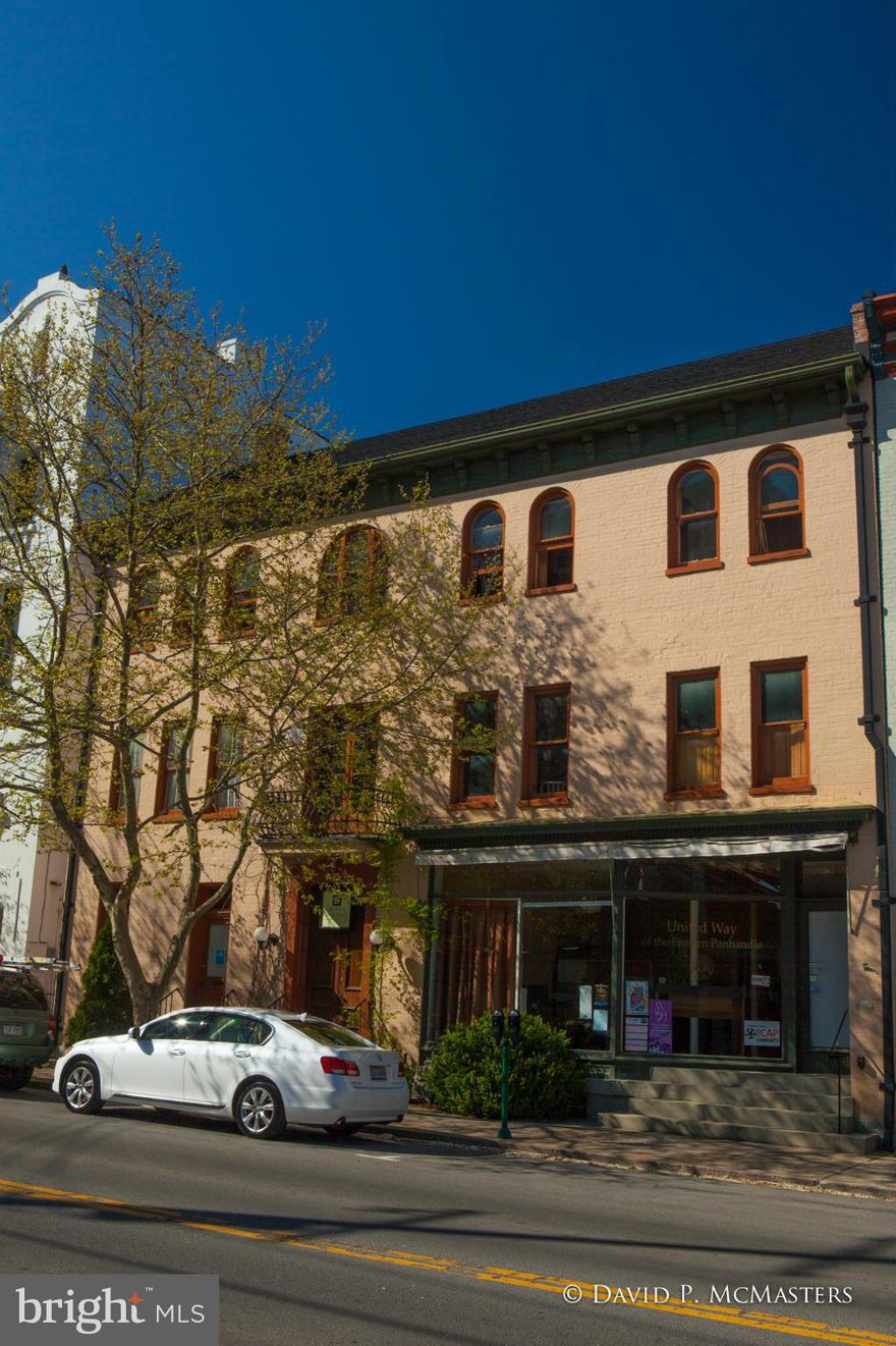 WOW! Gorgeously restored 5700 SF brick mixed use building across fr. Fed Cthouse. Architect/owners restored it, lived in it, now have offices on 2nd/3rd floor while renting 1st. Any/all could be rentals. Asethetically impeccable. All systems modern. See floorplans under "documents". Enjoy the photos. More info at BE8341270.   Great for small prof firm or to live + work at home. Great yard.