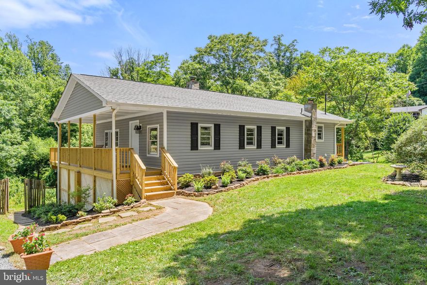 Charming Rambler with stunning renovation located in sought after Lake Front Royal.  This home sits on a beautiful private lot, backing to trees, with a huge wrap around deck to enjoy the amazing views! Exterior renovations include new roof, new siding, new deck, and brand new professional landscaping! Inside this open concept main level has tons of space, and has new flooring and paint throughout. The kitchen is bright and welcoming with new appliances (arriving soon), and a granite countertops.  There are 2 large bedrooms upstairs with a fully renovated full bath, with TONS of space. Downstairs has a large living space that is versatile in use! 2 additional bedrooms and a full bath, both completely renovated add to the appeal of this home. Other updates include new HVAC, new pressure tank, new interior and exterior doors. This one is a true must see!