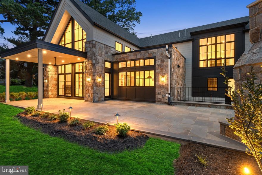 Welcome to 913 Drexel Lane, where modern transitional design meets meticulous craftsmanship on a peaceful one-acre lot in a private Bryn Mawr cul-de-sac. This nearing completion architectural gem boasts 8,110 square feet of luxurious living space. Upon entry, you're greeted by soaring cathedral ceilings and engineered 9" plank white oak floors on every level. The home features custom built-ins at every turn, including a stunning two-story wall of shelves in the great room.

The open floor plan effortlessly caters to both entertaining and relaxation, with expansive windows that fill the space with natural light. A sophisticated security system, integrated speakers inside and out, and pre-wired windows for automatic blinds add to the home's thoughtful details.

The chef’s kitchen is an epicurean’s delight, featuring a dual-fuel Wolf 6 burner with griddle, double oven range, drawer microwave, SubZero refrigerator, two wine and two beverage refrigerators, a generous island, butler’s pantry with wet bar, and a fully equipped walk-in pantry, along with island seating and a built-in banquette for casual dining. Additional highlights include an office, guest suite, two half baths, an enviable mudroom, access to the 3-car garage, and a spacious laundry room.

Upstairs, the primary suite offers a luxurious retreat with a spa-like bath, with a sizable multi-function dual shower, spacious walk-in closet, and cozy sitting room with picturesque views. This level also includes an upstairs pajama lounge overlooking the great room, three additional bedrooms—one with an ensuite—generous closets, a loft area, and an extra laundry room.

The daylight lower level provides versatile space with an entertainment area, guest/au pair suite, wet bar, a gym and ample storage. Outdoor living is elevated with a charming covered front porch and a partly covered flagstone patio featuring a stone fireplace and pre-plumbing for a kitchen, perfect for tranquil evenings.

Modern conveniences are woven throughout, including Wi-Fi switches, Cat 6 to all TV locations, four HVAC units with five zones, plus a garage split system, ensuring comfort and connectivity at every turn.

Experience the seamless blend of modern design and timeless elegance. This home offers proximity to transportation, shops, and restaurants. Don’t miss your chance to own this exquisite home. Schedule a private tour today to explore the work-in-progress and discuss the unique details with the builder. Please note, the property will be reassessed by the county upon completion.