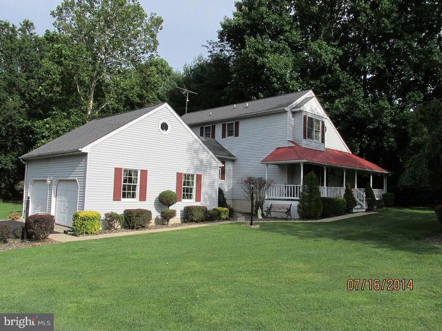 Beautiful contemporary home on well maintained 1 acre corner lot.  House has 4 bedrooms including 2 master bedrooms with baths.   1st floor kitchen, living room, dining area, and master bedroom with bath.  2nd floor master bedroom with bath and 1 bedroom with hall bath.   Finished basement has 1 bedroom and bath plus a large L shaped family room.