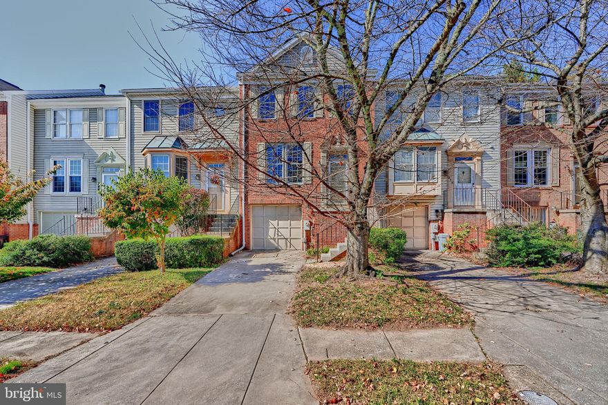 Welcome to this charming 3-bedroom brick front townhouse with an attached garage. The main level features an inviting living room, powder room & eat-in kitchen with ample cabinetry & pantry for storage. The dining room has French doors leading to your private deck overlooking open space & trees. Upper level has 3 bedrooms & 2 full baths. The primary bedroom offers a peaceful retreat complete with a walk-in closet, dressing vanity & an en-suite bath with shower. The Lower level boasts a cozy family room providing additional space for leisure or entertaining. This convenient location has easy access to major computer routes & nearby shopping. Seller replaced polybutylene piping. You don't want to miss this one!