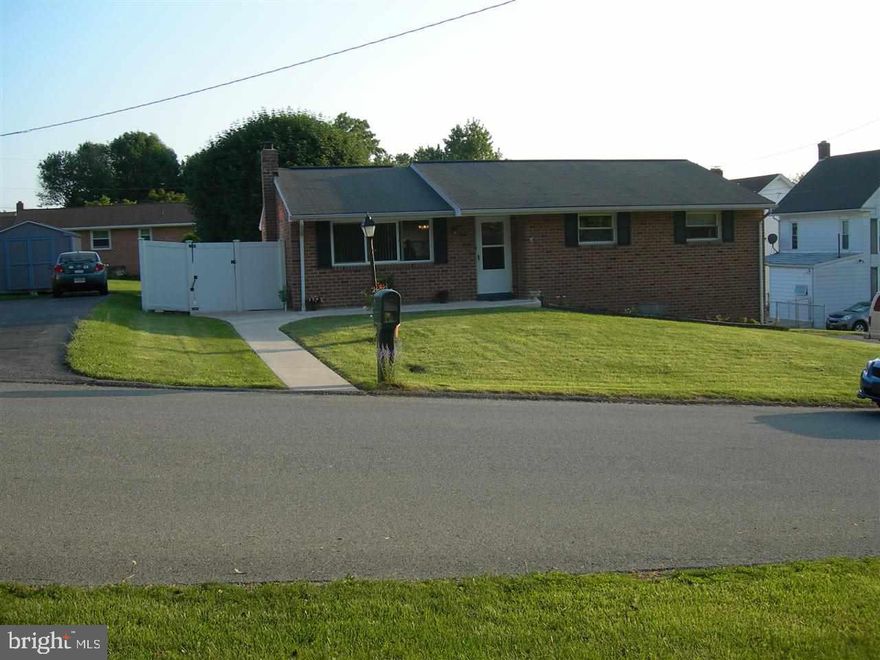 Wonderful home in Dallastown Schools sitting on a double sized corner lot, newly finished hardwood flrs, new carpet, freshly painted, updated baths, 4 bdrms, 2 full baths, finished fam rm in lower level, brick exterior including replacement windows, fenced yard & utility shed, forced heat with AC, new sidewalk and outdoor patio w/gas grill. Off street parking.