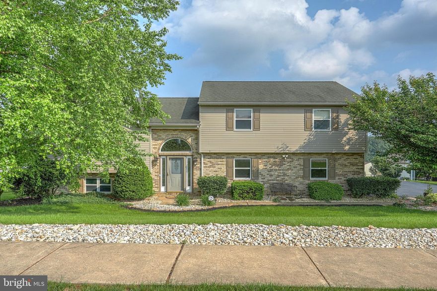 More than meets the eye!  This home is GORGEOUS!  Beautifully landscaped, level yard with multi level deck that is partially covered and has a lovely view.  Multi level living that includes both a living and family room.  Enjoy a covered porch great for entertaining in all weather!  Oversized garage with workshop area and storage with outside access.  This is a MUST SEE!!