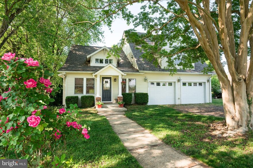 Prepare to be captivated by the charm and uniqueness of this remarkable home. Unlike any other, this vintage cottage has undergone extensive renovations, combining the best of both worlds—classic character and modern updates.

Step into the spacious master suite, located above the two-car garage, and be greeted by soaring vaulted ceilings and a cozy fireplace. The ensuite bathroom is a luxurious retreat, featuring double vanities and exquisite finishes. The open floor plan, achieved by removing walls, creates an inviting and airy atmosphere, while the original hardwood flooring and fireplace preserve the home's historic allure.

The kitchen is a true dream come true, boasting custom cabinets, a propane cooking range, double ovens, stainless steel appliances, and stunning granite countertops. With seating in the kitchen and a separate dining room, you have plenty of space to entertain family and friends.

Escape to the outdoors on the expansive, low-maintenance deck, perfect for enjoying the serene surroundings. The two-car garage provides ample space for parking and storage, adding convenience to your daily life.

The lower level offers additional living space, partially finished, and with a walk-out door leading to the side yard. Upstairs, you'll find a versatile loft area, ideal for a kids' playroom, office, or tranquil library. This home encourages you to unleash your imagination and embrace a lifestyle filled with creativity and individuality.

Conveniently located just off Rt 260, this property provides easy access to North Beach, a vibrant community with an array of Chesapeake Bay attractions. From water parks and the Chesapeake Resort to farmers' markets, beaches, and outdoor concerts, this area offers a multitude of activities to enjoy. And let's not forget the excitement of potential fireworks displays! Best of all, there are no covenants restricting your freedom to make this house your own.

Don't miss the opportunity to make this extraordinary home yours. Embrace a living experience that goes beyond the ordinary and celebrates the essence of true individuality, now with the added convenience of a two-car garage.