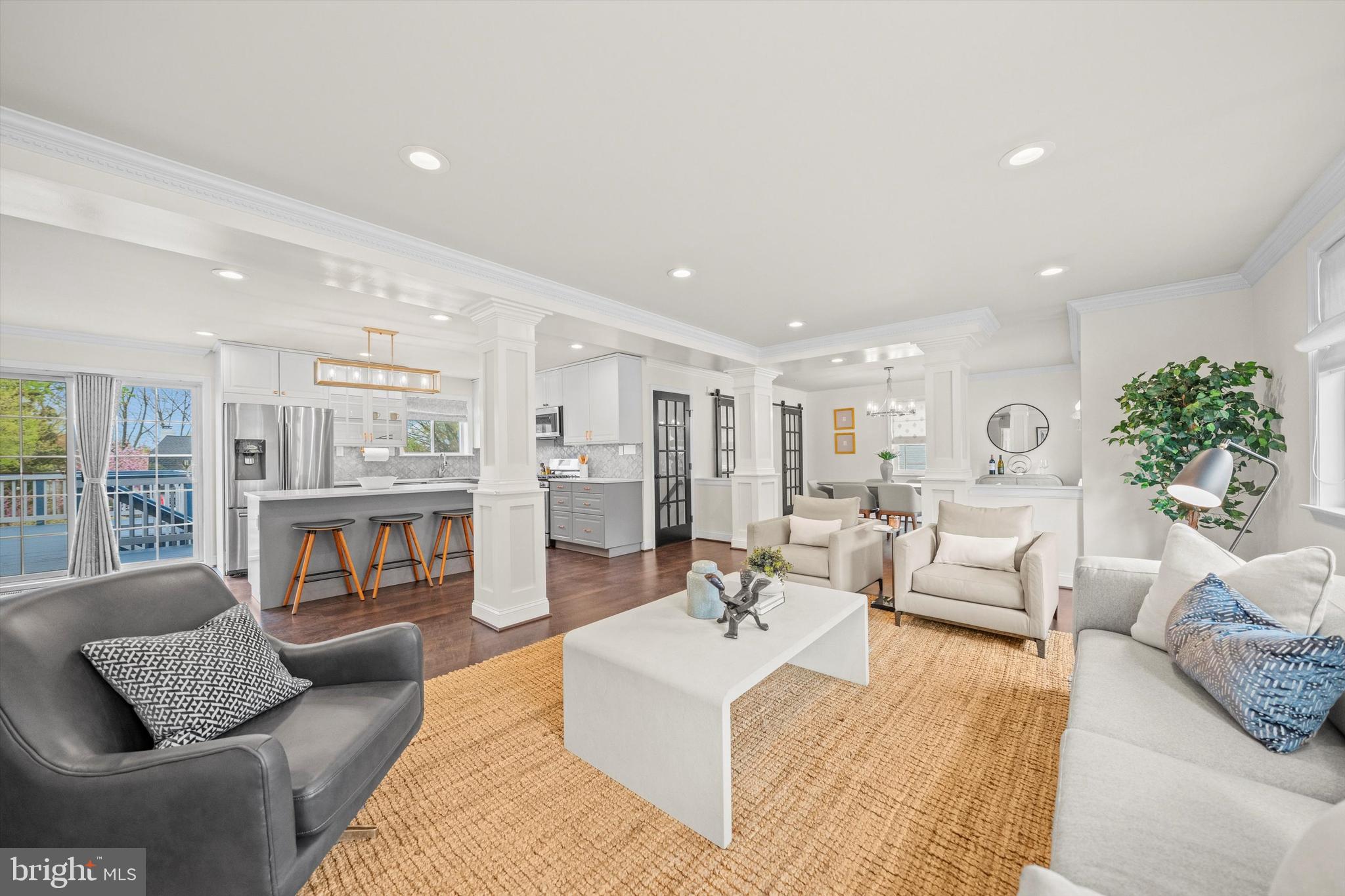 SIGNIFICANT PRICE REDUCTION! Wow! This sparkling and spacious renovated ranch/rambler features a contemporary open plan suitable for today's lifestyles. Extensively renovated in 2018, features include an open concept living/dining/kitchen with two bedroom suites plus a den/office/third bedroom on the main floor and a vast family/exercise room on the walk-out lower level along with a large bedroom and third full bathroom. The kitchen offers a large island/breakfast bar, excellent quartz counter space and handsome cabinets plus easy access through sliding glass doors to a big deck overlooking the uncommonly large (.30 acre), verdant level back yard with patio and pergola. Owned solar panels for economical energy plus new systems in 2018 and new roof in 2019. There's also ample on-site parking and a Tesla charger. Excellent, move-in condition. Only one block to Washington Golf and Country Club and in proximity to Ballston, Metro, many shopping and dining choices and easy access to the District via multiple routes.