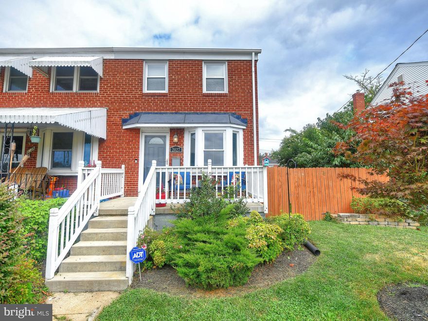 Welcome Home to 2027 Inverton Road, an incredibly charming three bedroom, two full bathroom end of group brick townhome located steps from the water and a community boat ramp/pier. You will fall in love with this home as soon as you arrive, boasting tremendous curb appeal from it s beautifully landscaped front yard and front porch with views of the water and baseball field across the street. The rear of this home boasts a fully fenced-in yard with a patio and covered deck...ideal for entertaining.  We enter this home to find gleaming hardwood floors in the sun-filled living room. Being an end-of-group, this home boasts several additional windows on the side of the home that fill it with tons of natural light. You ll be pleased to know the entire home boasts attractive, neutral paint. Kick back and relax in your spacious living room, which flows nicely into the separate dining room. This space offers cabinetry, counterspace, and an elegant fixture...ideal for family meals!  Adjacent to the dining room is the stylish kitchen, boasting black stainless steel appliances, laminate granite countertops, tile backsplash, and tile floors. There is ample cabinetry and counterspace between the kitchen and dining room! Take the door from the kitchen out to the covered deck, where you can conveniently grill and entertain guests!  Ascend to the upper level where we find three bedrooms and a full hall bathroom conviently located.  The full bathroom is beautifully remodeled with a trendy vanity and tile shower. All three bedrooms offer soft carpet and neutral paint. An attic can be accessed from the upper level landing, offering generous storage space.  Descend to the lower level where we find a completely finished space, with updated laminate hardwood flooring, attractive paint, chair rail molding, and extensive space. There is a full bathroom and a laundry area as well. A door leads up to the rear yard!  Fully updated throughout, move-in ready, and ready for you to call home! What are you waiting for?