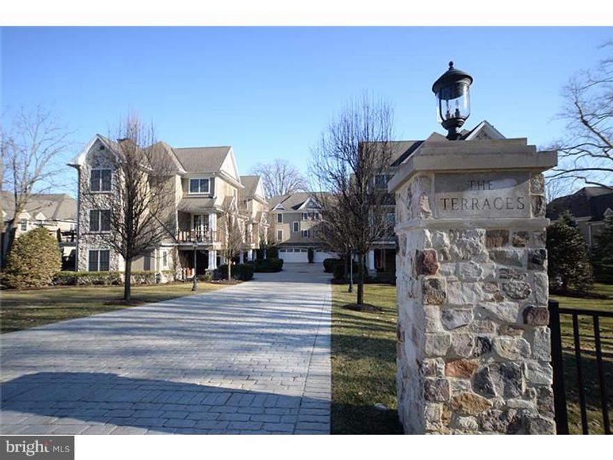Spectacular Carriage House located the "The Terraces" in Devon.  A community of only six carriage homes.  Built by one of the Main Line's most renowned builders, C.F. Holloway, this home offers a convenient South Devon setting and features luxurious appointments inside and out from the cobblestone style courtyard entry, which provides privacy & security, to the custom finishes throughout the three levels of living space conveniently accessed by the homes elevator. Gourmet Kitchen includes Woodmode cabinetry, granite counter tops and integrated appliances by SubZero and Thermador (Plus: wine frig, warmingdrawer, microwave; radiant heat.  Luxurious Master Bedroom Suite features a sitting area, spacious walk-in dressing room, marble spa like Bathroom with radiant heat, air-jet tub, shower with frame-less glass door and large double vanity. Two additional bedrooms each feature their own en suite baths. Glorious light filled Living Room/Great Room (with Radiant Heat), Den and Office (both with built ins) complete the living space; Extra bonus, plantation shutters have been installed throughout; Natural gasline run to deck for grill and NEW Whole House Generator...  Multiple decks offer lovely views of the grounds and surroundings, peaceful retreats for dining or lounging.  All this as well as the convenience of a homeowners association which provides maintenance of the building and grounds; amazingly low taxes for this elegant home.  This is truly the home for your most discriminating buyers! Welcome Home!