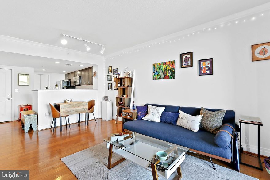 Rarely available unit with spectacular views of Baltimore City. Walk into the open concept living space with hardwood floors, crown molding and tons of natural light. The kitchen has been recently updated with brownstone cabinets and quartz countertops. The living room is ideal for relaxing with a good book or watch your favorite movie. The glass sliding door leads to the balcony where you can enjoy a cup of coffee while checking out the city views.  1 large bedroom with plenty of light and closet space. Enjoy the updated bathroom with new flooring, sliding glass shower, granite countertop sink with access from the living room and bedroom. In-unit laundry makes for easy convenience. The building offers many amenities including front desk concierge, laundry service, 24 hour gym, roof top pool, office center, and party room with bar/lounge! Water, gas and parking are included in the condo fee. Convenient location to all that Baltimore has to offer, walking distance to the Inner Harbor, Federal Hill, Harbor East and Fells Point. Close to Johns Hopkins Hospital, Mercy Hospital and University Of Maryland Medical Center and on all major bus routes.