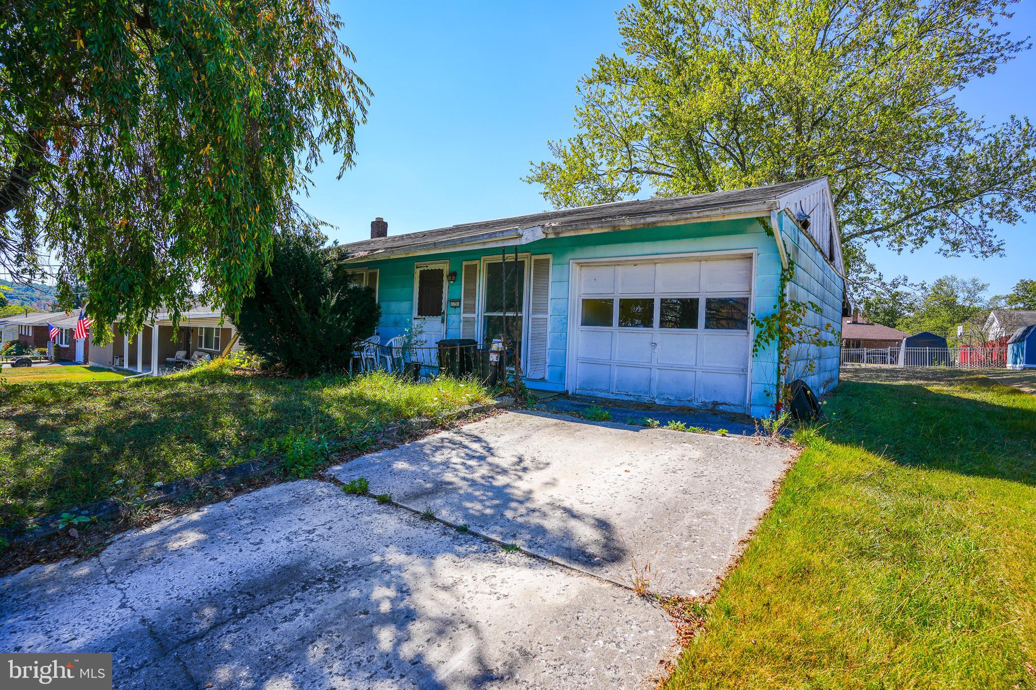 LOCATION!!! HUGE potential in Meadowcrest Estates, Mahoning Township—just outside Lehighton and close to everyday conveniences and outdoor fun! Minutes to major routes including PA-443/Blakeslee Blvd, US-209, PA-248, and the PA Turnpike Northeast Extension (I-476, Exit 74) for easy Lehigh Valley, Poconos, and Turnpike access. Nearby attractions include Beltzville State Park for boating, hiking, and fishing, the D&L Trail Lehighton Trailhead for biking/walking, and Lehigh Gorge State Park/Jim Thorpe for river and rail-trail adventures. Everyday shopping and services along Blakeslee Blvd (PA-443) are just a short drive—Lowe's, GIANT and Walmart Supercenter are both nearby. Ranch layout offers a living room, eat-in kitchen, 3 bedrooms, and a full bath on the main level. Lower level provides laundry and space that could be finished for additional living area. Outside features an attached 1-car garage, great backyard, and a patio. Home is in poor condition. Being sold AS-IS—significant personal property remains and the home is not well-kept. Bring your vision and renovation plans to unlock value in a terrific Mahoning/Lehighton location! (Buyer responsible for any inspections, clean-out, and municipal requirements.)