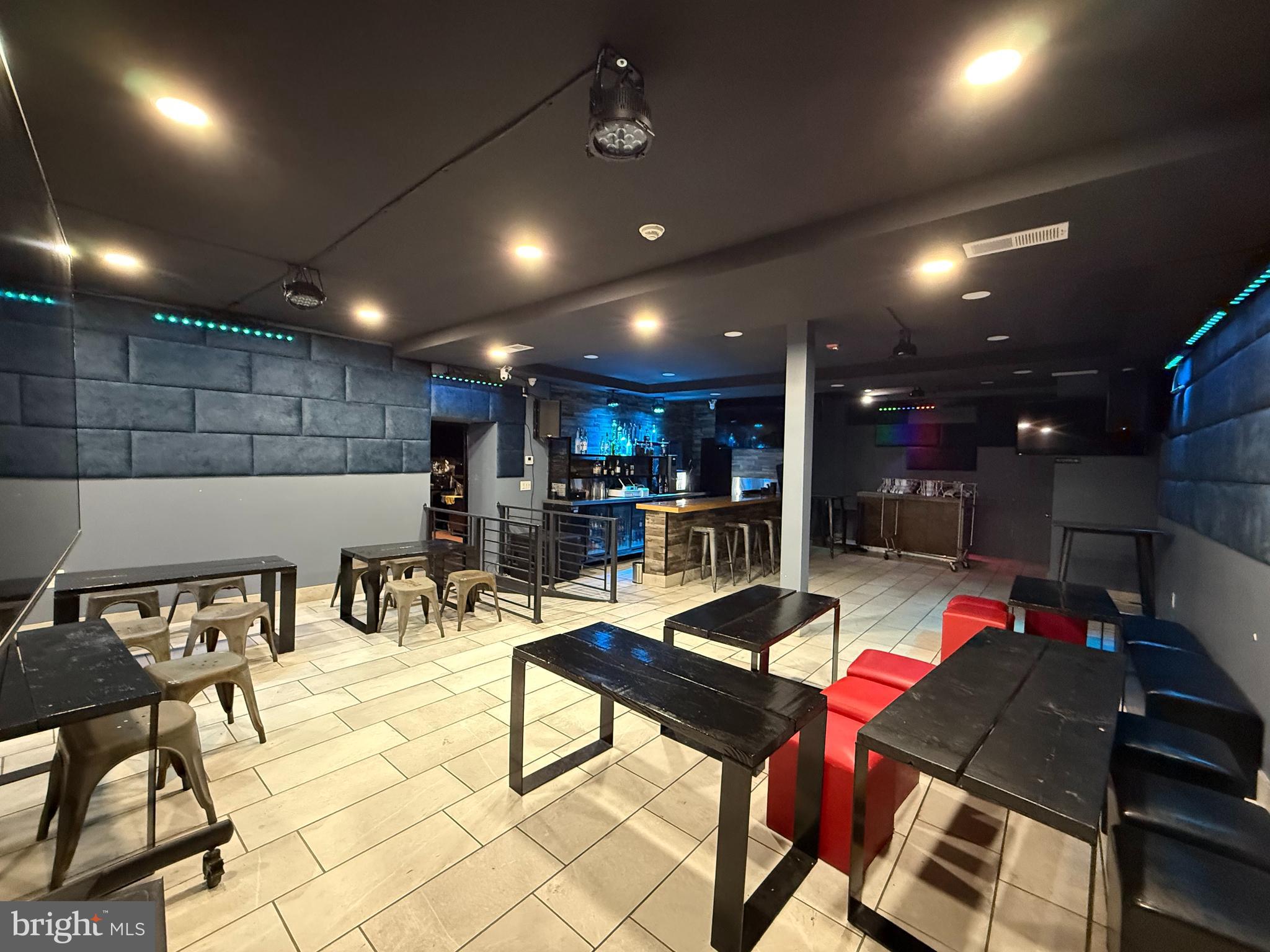 Ground floor retail space available featuring an open floor plan and two bathrooms. Soundproof panels at the front can be removed to enhance visibility and storefront frontage.