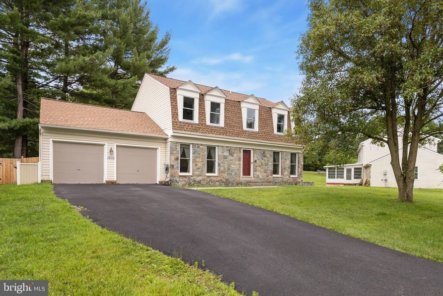 Offers due Tuesday at 6pm.  You will love this spacious home in popular Stonegate with terrific upgrades such as a new roof (2021), renovated kitchen and baths, new appliances, new paint, recessed lighting, and new flooring.  The classic floor plan features a gracious foyer that opens up to both the dining room and formal living room boasting near floor to ceiling windows ensuring ample natural light.  The large eat-in kitchen is beautifully updated with granite countertops, tiled backsplash, pendant lighting, and brand new appliances. The kitchen leads to a large family room for more relaxed living and entertaining and is centered by a handsome tiled fireplace hearth. From the family room, step out onto your outdoor deck to enjoy dinners al fresco or outdoor enjoyment. The main level home office is a perfect space for the work-from-home professionals and it opens up to a sunroom.  The powder room is conveniently tucked away.  Upstairs, you will find all the comforts of home in the 4 sunlit bedrooms and 2 full bathrooms.  The large primary bedroom is a peaceful retreat complimented by a sitting room, walk-in closet, and a beautifully renovated  bathroom.  Three additional bedrooms and a sizable hall bathroom complete the upper level.  The finished lower level provides additional living space, a kitchenette, full bathroom, storage, and another room that you may consider using as a 5th bedroom.  Be sure to check out the large, 2-car garage, complete with a workshop bench.  Easy access to both Stonegate Elementary School & Stonegate Swim Club while also being close to the ICC, DC & Baltimore.