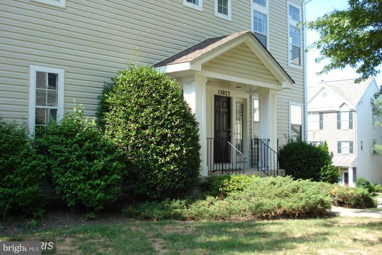 End unit located close to conveniences; 2 story living room, lots of space. Brazilian hardwood floors! Newer HVAC system! Deck! Garage! personal driveway! Lots of light!