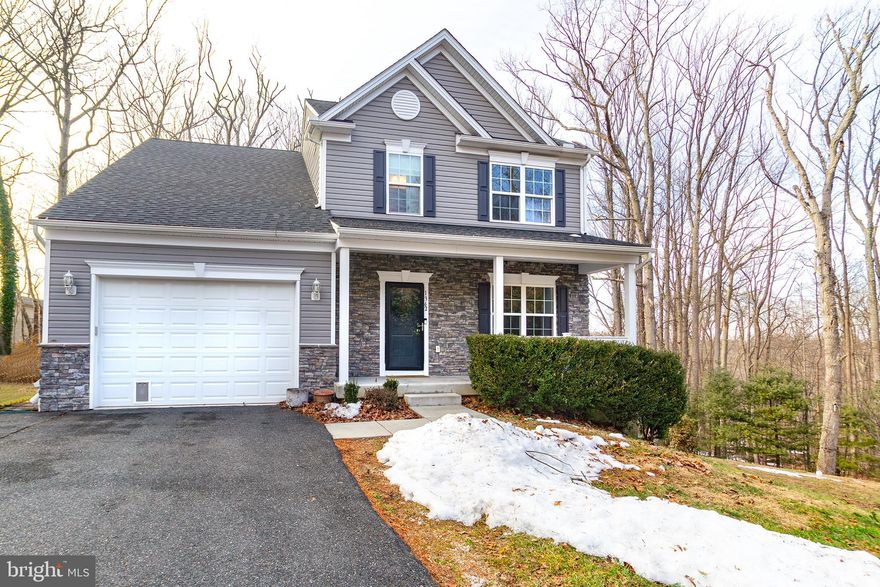 Welcome to 1362 Rockridge Road—where modern design meets peaceful country living in one of Harford County’s most desirable locations. Built in 2019, this beautifully maintained 4-bedroom, 3.5-bath Colonial sits on a private one-acre lot backing to mature woods, offering the perfect balance of privacy, tranquility, and convenience. Step inside and immediately notice the quality craftsmanship throughout. Wide-plank engineered hardwood floors, enhanced lighting, and recessed lighting create a warm and refined atmosphere. The heart of the home is the kitchen, featuring stainless steel appliances, granite countertops, upgraded 42” cabinetry, and a walk-in pantry. The open-concept layout flows seamlessly into the inviting family room, highlighted by a stunning stacked-stone fireplace with raised hearth and stone mantel—perfect for relaxing evenings or entertaining guests. Upstairs, the spacious primary suite offers a true retreat with vaulted ceilings, a walk-in closet, and a private en-suite bath. Three additional bedrooms provide ample space for family, guests, or a home office, while the convenient upper-level laundry makes everyday living easier. The fully finished basement expands your living space even further, complete with a full bathroom and versatile open area ideal for a recreation room, media room, guest suite, or home gym.
Step outside to the oversized maintenance-free deck and take in the peaceful wooded backdrop—perfect for embracing nature while enjoying morning coffee, outdoor dining, or weekend gatherings. The inviting covered front porch provides another relaxing space to unwind and enjoy the surrounding countryside. Additional features include a one-car attached garage, energy-efficient propane heating, central A/C, and the freedom of no HOA.  Ideally located near schools, churches, and shopping, and just 15 minutes from downtown Bel Air, this property offers the perfect combination of modern comfort and serene living.