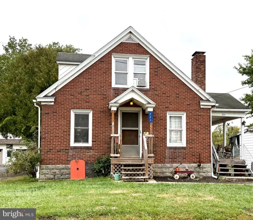 This classic brick-style Cape Cod is full of charm and warmth.  Step inside to a cozy living space featuring a brick fireplace and hardwood floors. The thoughtful layout offers one bedroom on the main floor and two additional bedrooms upstairs — perfect for a home office or a playroom. Just off the dining/kitchen area, an enclosed, heated sunroom adds year-round living space and natural light. Outside, relax on the covered front porch — the ideal spot to enjoy peaceful evening sunsets. A detached garage and additional carport offer plenty of parking and storage options. Tucked away in a quiet, friendly neighborhood, this home is conveniently located near Mill Hall's community park, schools, shopping, and is just a 35-minute drive to either Williamsport or State College.
