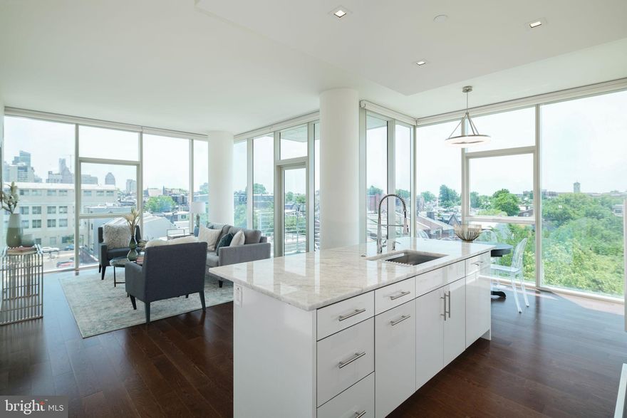 Built by premier developer Carl Dranoff and designed by acclaimed architect Cecil Baker, One Riverside is located in historic Fitler Square and within easy walking distance of Rittenhouse Square, University of Pennsylvania, Drexel University, 30th Street Station, The Cira Center and CHOP. This sunny 2 bedroom 2.5 bath South East corner apartment with a valet PARKING space and TAX ABATEMENT through April 2027 features many upgrades including wood floors throughout: natural Quartz countertops, stone backsplash, stainless steel kitchen sink and deluxe faucet, interior kitchen cabinet storage, Miele stainless steel appliances, customized closet systems, electric window shades and glass powder room sink. East, South and West views of the river, park and the Schuylkill River Trail. The building is adjacent to the 60 mile Schuylkill River Trail,  recently named best urban trail in the nation. Next to Schuylkill River Park with with two dog parks, tennis and basketball courts and Markward Playground. One Riverside has a state of the art fitness center with lockers rooms, showers, saunas, steam rooms, 60' indoor lap pool, outdoor patio, outdoor kitchen with grill, community room with catering kitchen, business center, board room, elegantly appointed hospitality suite, landscaped garden and lawn, 24/7 concierge/doorperson and 16 hour town car. Valet parking fee is $295/month. Pet friendly building.