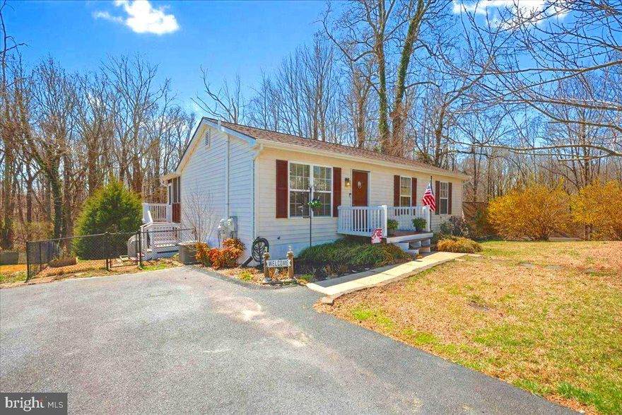 Spring is in the air and soon the bulbs will burst with color all around this cozy, comfortable, sun-filled part of your paradise. This home sits near the end of a quiet cul-de-sac with plenty of off street parking. Enjoy morning coffee on your private screened in porch while watching song birds visit and listening to all the sounds of nature waking up overlooking a large open wooded area where nature comes to play. Many thoughtful renovations and upgrades throughout ensuring comfort and style at every turn.  Features and Updates include: New LG Refrigerator,  New LG Oven, New LG Dishwasher,  Renovated Screened Porch with New Stairs,  Updated main level Bathroom with New flooring.  New Roof/Gutters in 2020,  HVAC replaced 2015.  Some windows replaced in  2020.  Lower Level has Large Bedroom with over-sized window  and a Walk-in-closet.  Lower level bathroom was been updated. Many rooms have been freshly painted. The walk-out sliding doors lead to a large patio perfect for entertaining.  The back yard is fenced in with lots of privacy.  Convenient storage area is  located under the screened porch in rear of house.  Just moments away  from local restaurants,  playgrounds, a newly opened library, sandy beaches, quaint shops, and more.  Immerse yourself in the vibrant beach community of Chesapeake Beach and then minutes later the quiet serenity of  your wooded paradise.