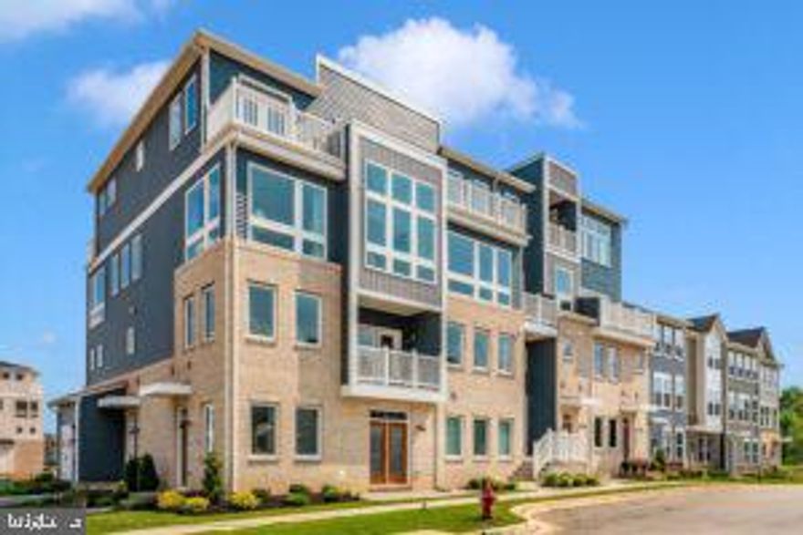 Former builder model with over $35,000 in premium upgrades, this fully finished Napa model offers a compelling alternative to new construction. With more than 2,500 square feet across two levels, it is among the largest and most functional condo floorplans in the community, offering the space and feel of a townhome—or even a single-family home—without the maintenance.

Occupying the top two floors, the home is filled with natural light from windows on multiple sides and shares minimal common walls, providing exceptional privacy and an open, airy feel throughout.

The main level is designed for both everyday living and entertaining, featuring a wide-open layout that seamlessly connects the kitchen, dining, and family room. The kitchen includes a large center island, generous prep space, and room for a full dining table and comfortable seating area. A separate office or flex room on this level provides an ideal work-from-home setup without sacrificing bedroom space.

Upstairs, you’ll find three spacious bedrooms, two full baths, and a versatile loft well-suited for a second living area, playroom, or media space. Bedroom sizes exceed what is typically found in townhomes, making the layout practical for families, guests, or long-term flexibility.

Three private balconies/terraces add valuable outdoor living space. As the builder’s former model, the home features high-end finishes throughout, including luxury vinyl plank flooring, quartz countertops, upgraded appliances, custom trim details, a fireplace, and smart home features. The home is completely turnkey and has never been lived in.

Exterior maintenance, roof, and landscaping are handled by the condo association—offering the space of a townhome without the upkeep. Ideally located near I-70, I-270, Route 15, shopping, and downtown Frederick, this is a rare opportunity to own one of the largest and most upgraded homes in the community, now offered at an exceptional value.