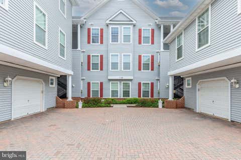 Photo of 5 Hawk Rise Lane #104, OWINGS MILLS, MD 21117 (MLS # MDBC2171810)