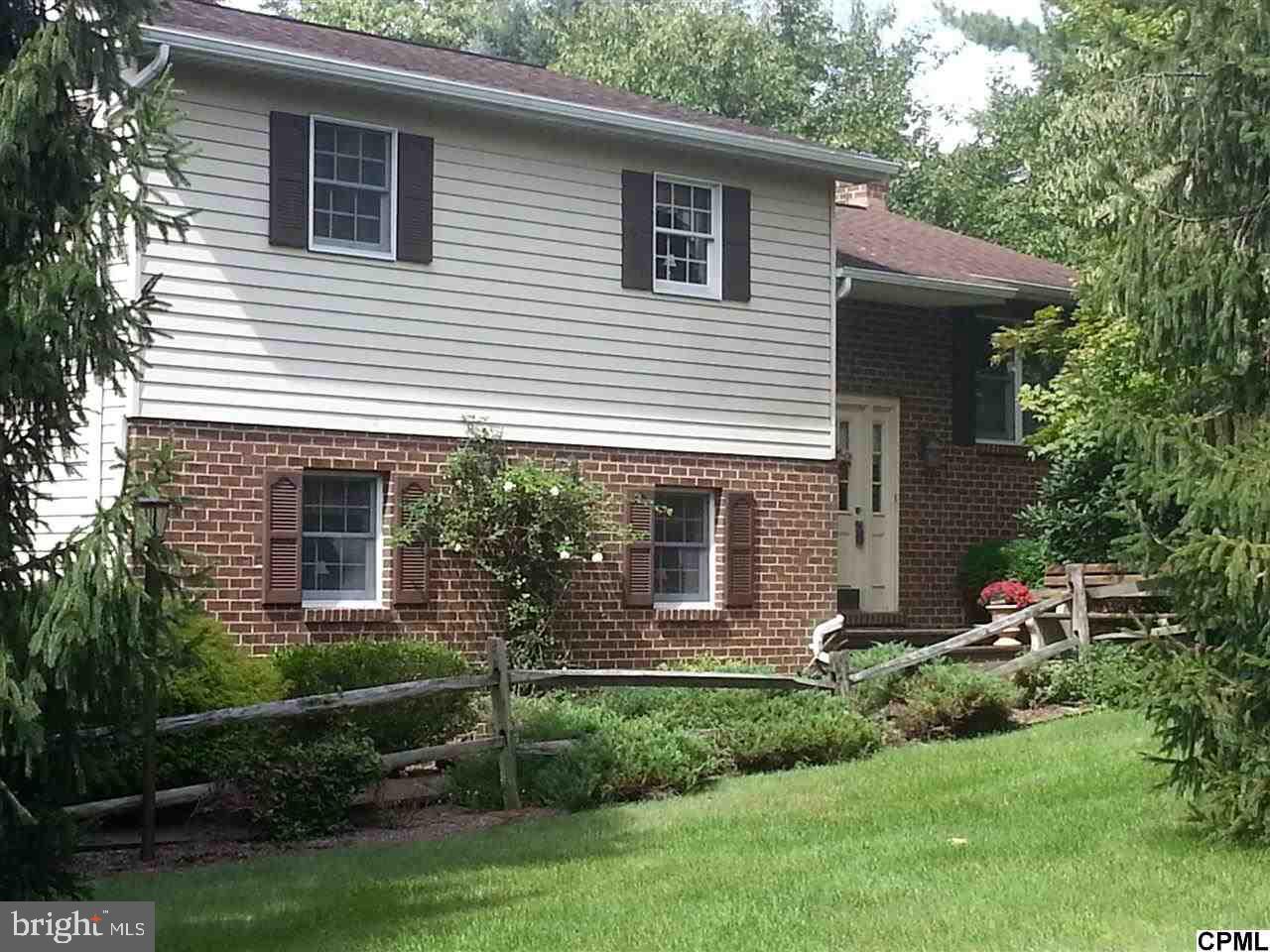 Enjoy the peace and serenity at this tastefully updated mini estate situated on a private 2+ acre lot just a few short steps from Yellow Breeches Creek. Updated granite and tile kitchen, hardwood in LR & DR. Beautiful stone wood burning fireplace in family room. 4 stall multi-purpose barn, workshop and loft, suitable for farm animals. Beautifully fenced pasture. 18x36 in-ground pool and multiple decks and patios.