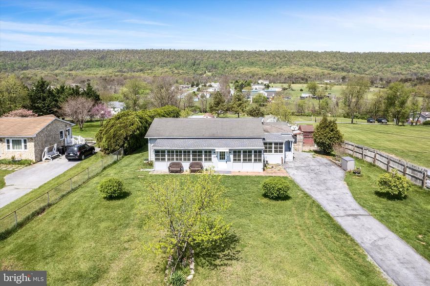 Charming 3-bedroom, 1-bath home on a spacious 1.05-acre lot offering privacy, space, and versatility. You'll love the light-filled 4-season porch, generous living room, and open eat-in kitchen with adjoining laundry, large pantry, and a flexible office or craft room. The nicely sized bedrooms and full bath with tub/shower combo offer comfort and convenience. Step outside to enjoy the above-ground pool- just in time for summer, multiple sheds (one with a lean-to), and an enclosed workshop off the porch—perfect for hobbies or storage. The real showstopper is the backyard: private, expansive, and ready for relaxing or entertaining. A rare find with room to spread out and make your own!