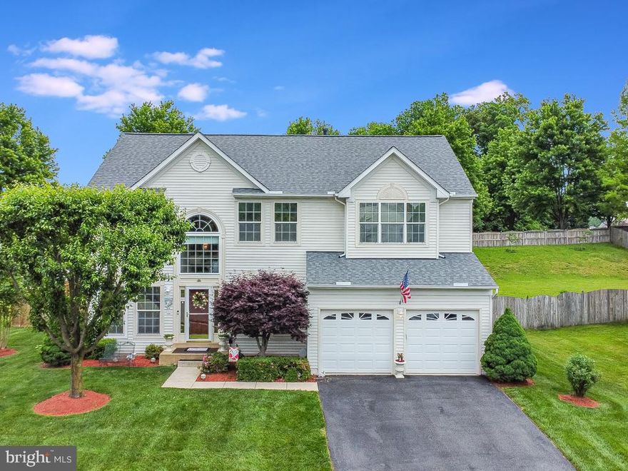 Welcome home to Blooms Crossing in Manassas Park! This 3 level home boasts pride in ownership from the current owners.  Looking from the outside, you can quickly tell that these homeowners take care of every inch of this home.  The lawn and landscape are professionally maintained and is the envy of the neighborhood.  As you enter, you are greeted by both a formal dining and living area.  A main level office is conveniently located off the main family room.  The open floor plan flows easily from the family room, dining room and kitchen.  The kitchen has tons of storage space and a walk-in pantry.  Off the kitchen is a screened in porch perfect for year-round entertaining.  As you enter the basement, you begin to feel that the entertainment is following you.  There is plenty of space for a pool table and bar along with a play area.  The best part of the home is your very own home theatre! Yes, what you see is what you get! All of the theater equipment stays with the home!  Head upstairs and see even more space with a whopping 5 bedrooms!  The master bedroom has a large walk-in closet along with space for a reading/sitting area. The master bath has a soaking tub along with a newly remodeled shower.  Roof is roughly 5 years young, hardwood floors on the main level are new, air purifier was installed in 2021,.  You are minutes away from Signal Hill Park, shopping and restaurants along Liberia Ave.   Come see this home while you can!!