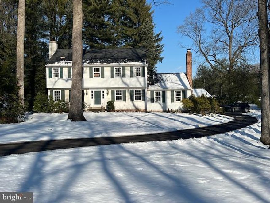 A timeless Bucks County Colonial is now available in the sought-after Pebble Hill neighborhood. Set back from the road along a winding drive, this gracious Center Hall Colonial backs to a preserved tree farm, offering rare privacy and serene, long-distance views. Thoughtfully maintained and tastefully updated, this home is refined without feeling formal and polished without feeling stiff.  With 4 bedrooms and 2.5 baths, the home features hardwood floors throughout, two fireplaces, and custom built-ins throughout, reflecting the care and quality invested over the years. The inviting Foyer opens to a gracious Dining Foom, a bright and welcoming space enhanced by natural light—perfect for hosting holiday gatherings and everyday family meals. The grand Living Room spans the full length of the house and features an elegant fireplace with a Delft-inspired tile surround, along with French doors that invite easy flow. At the heart of the home, the sunny, updated Kitchen features wide plank Ash floors, a large granite island, stainless steel GE appliances, a charming window above the sink, and a cozy breakfast area framed by a bay window and a wall of custom built-ins—ideal for busy mornings and relaxed evenings alike. The adjacent Family Room provides a warm, comfortable retreat with a second fireplace and another wall of beautifully crafted built-in bookshelves and the lovely wide plank Ash floors. A powder room and convenient laundry room complete the first floor. Upstairs, the Primary Suite features its own Full Bath and three wall closets, while three additional good-sized bedrooms offer ample closet space and flexibility for children, guests, or home offices. A sunny yellow Hall Bath with updated vanity and a tub/shower combination serves the additional bedrooms. The full basement, currently unfinished, provides excellent storage and future potential.  Step outside to the sweet back porch, the perfect spot to enjoy a quiet morning coffee while overlooking the peaceful preserved land beyond. The backyard also features a brick patio with stone wall, along with an additional stone wall around the perimeter of the house that adds timeless character. The detached two-car garage, thoughtfully angled, enhances the home’s classic appeal. Located on a winding, quiet road just minutes from Historic Doylestown Borough and Buckingham, and within the award-winning Central Bucks School District, this lovingly cared-for home offers the ideal blend of charm, comfort, and location. Pride of ownership is felt throughout, with intentional upgrades that enhance both beauty and livability. Showings begin on Friday, 2/13.  ***Professional photos will be uploaded on Friday.  OPEN HOUSE on Saturday, 2/14  from 11:00-2:00 p.m.