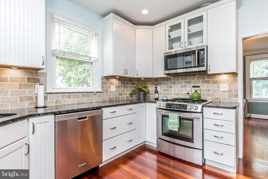 Over 3000sf of Liv'g Space & ALL UPGRADES you want! High-end Kitchen w. SS appliances, Granite. Sunrm doubles as Main Lvl Bdrm w/ Ensuite Bath. Basemt has Large Fam. Rm, Full Bath & Sep Wrkshop Rm. Covered Deck & Charming Flagstone Patio. Huge Yard!  NEW ROOF ('15), NEW BOILER ('17), HWH ('14), NEW Front Shutters. 2 block walk to MARC station!!  Only minutes to airport, breweries & state parks.