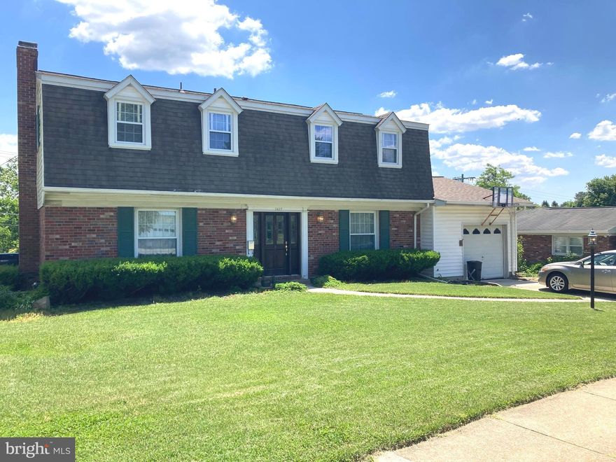 MAJOR PRICE REDUCTION ..... SELLERS ARE WILLING TO ASSIST BUYERS WITH CLOSING COSTS BY WAY OF A SELLER CONTRIBUTION AT SETTLEMENT.   Home Warranty included.   Spacious and solidly built Colonial style home with hardwood floors throughout except tile in bathrooms, foyer and kitchen,  Formal living room with wood burning fireplace, separate dining room,  kitchen/family room opens to awning covered patio.  First floor laundry room with entrance to attached oversized garage.  Primary Bedroom with walk in closet, hardwood floors under carpet and remodeled bath.  Three other bedrooms and full bath on upper level.  Improvements include furnace and A/C, roof (5 yrs) with underlayment, replacement windows, large bank of windows added to kitchen/family room, dishwasher (3 yr), stove with self-cleaning oven (1 yr).  Hoffman awning over large patio with beautifully landscaped berm blooming with lovely perennials.  Large rear lawn does not look into other homes.  Separate storage shed with electric service for lawn equipment. Contractor's brochure & pricing of new kitchen for review at listing along with Lender's numbers for mortgage plus renovation loan.