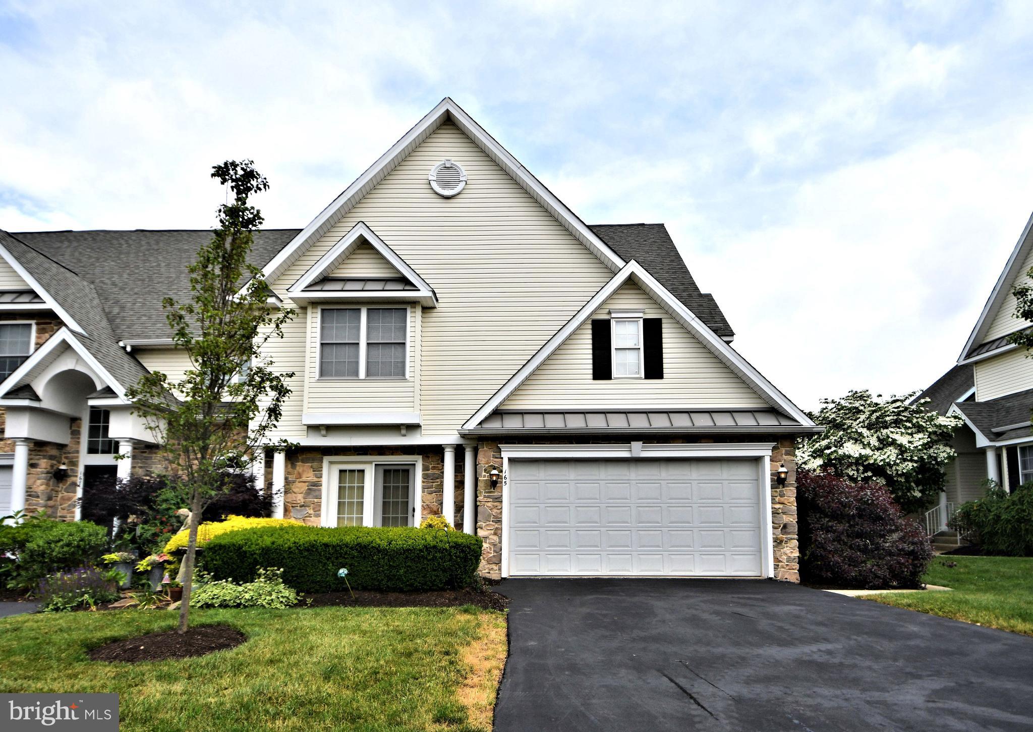 First floor owners suite!  Beautiful and well cared for end townhome in the Carriage Crossing community of 20 homes located on a cul-de-sac.  As you enter your home, you will find the living room on the right, with cathedral ceiling, a gas fireplace and patio doors to the deck.  Cross back over the foyer, and walk into your formal dining room with crown molding and a box bay window.  Off the dining room is a spacious kitchen, with granite countertops, gas range, pantry closet, and a breakfast area with patio doors that open to the front of the home.  A very spacious owners suite is found on the first floor as well.  The owners bath has a separate soaking tub and shower, and tile floor.  On the second floor, you will find three generously sized bedrooms, a hall bath and laundry room.  The unfinished walkout basement has 9' ceiling height. A two car attached garage that leads into the kitchen, makes bringing in the groceries that much easier.  Seller is having the roof replaced, which will occur either June or July.  This home is located close to many amenities, Skippack Village is only 10 minutes away, Green Lane Park is nearby, sought after Souderton Area School District, close to major commuter routes of PA Turnpike, Routes 113, 63, 309 and 29.