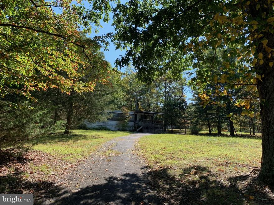 Great investment opportunity as current tenant would like to remain OR make your primary home OR build new!  Beautiful lot with combination of open area and forest with mature hardwoods.   Convenient yet private location with tranquil atmosphere - a true gem!!