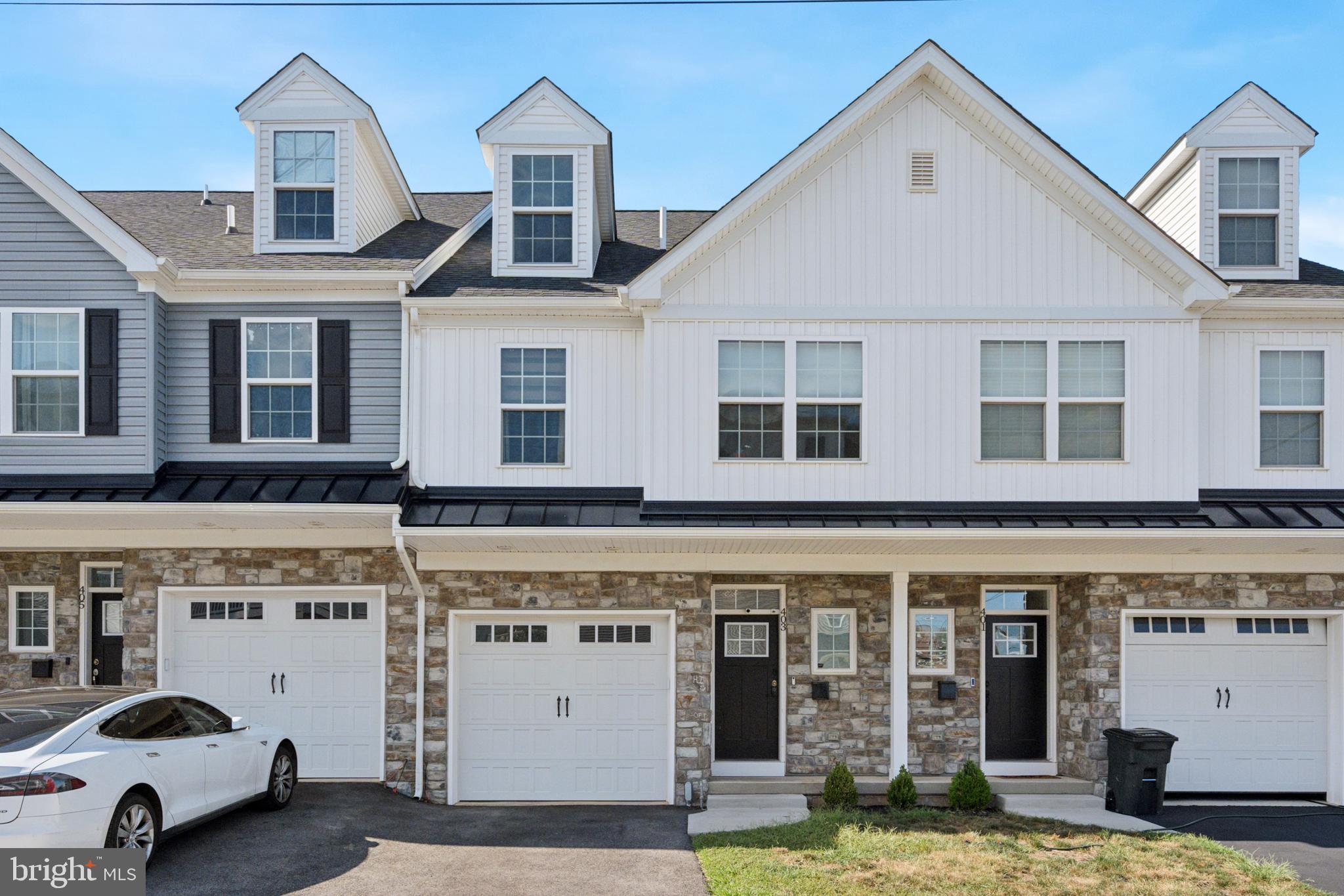 Welcome to 403 Hurst Street—a modern, 4-year-young luxury home in the heart of Bridgeport Borough!
Step inside and be greeted by a spacious open-concept floor plan, soaring 9-foot ceilings, and an abundance of natural light. This 3-bedroom, 2.5-bath home has it all: a finished walkout basement, single-car garage with driveway parking, and stylish upgrades throughout. The gourmet kitchen is the centerpiece of the main level, boasting a 6-foot island, white cabinetry, granite countertops, stainless steel appliances. Off the kitchen, is a bright combination living and dining room with access to the rear deck, creating a seamless flow for everyday living and easy entertaining. Upstairs, retreat to your private owner’s suite, complete with a walk-in closet and a spa-like bath featuring a walk-in tiled shower and ceramic tile flooring. A convenient second-floor laundry closet, full hall bath, and two generously sized bedrooms with ample closet space round out this level. On the third floor, you’ll find a versatile finished loft—ideal as a fourth bedroom, home office, guest suite, or rec room. The possibilities are endless! Located in the award-winning Upper Merion School District, this home also offers unbeatable convenience. Just minutes to King of Prussia and Conshohocken, plus walkability to Bridgeport’s charming shops, restaurants, and bars, you’ll enjoy both modern living and small-town charm. Best of all, this home comes with low property taxes and no HOA fees—a rare find! Don’t miss your chance to own this stunning home—schedule your showing today!