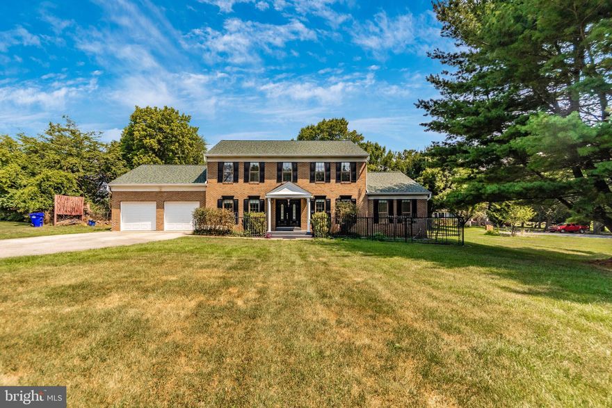 Welcome to this stunning Colonial home that combines modern updates with classic charm! This spacious home boasts a range of features that cater to comfort and convenience. As you step inside, you'll be greeted by gleaming hardwood floors that adorn the main level, where one of the two primary bedrooms is conveniently located. The living room is a spacious entertaining area with a gorgeous brick fireplace in the center of the room. The updated kitchen is a chef's dream, featuring new granite countertops and a stylish backsplash. For added convenience, there's a second kitchen in the garage, perfect for outdoor entertaining or extended family living. Upstairs, you'll find carpeted floors in all bedrooms, including the second primary bedroom, each equipped with wall-mounted A/C units to ensure comfort year-round. The finished lower level offers versatile space with three additional rooms, ideal for guests, home offices, or recreational use. The outdoor areas are equally impressive with a paved backyard patio and a roof patio, providing ample space for relaxation and entertainment. The roof, only 5 years old, comes with a 15-year warranty and is covered with durable 50-year shingles, ensuring long-lasting protection. Additional features include a 2-car garage, an HVAC system less than 5 years old, and a water heater that is 10 years old. The carpet throughout the home is in good condition, being just 6 years old. Located in the heart of Spencerville, near shopping, restaurants and plenty of parks and golf courses for outdoor enjoyment. Don't miss out on the opportunity to own this beautifully maintained home that perfectly balances modern amenities with timeless elegance. Schedule your showing today!