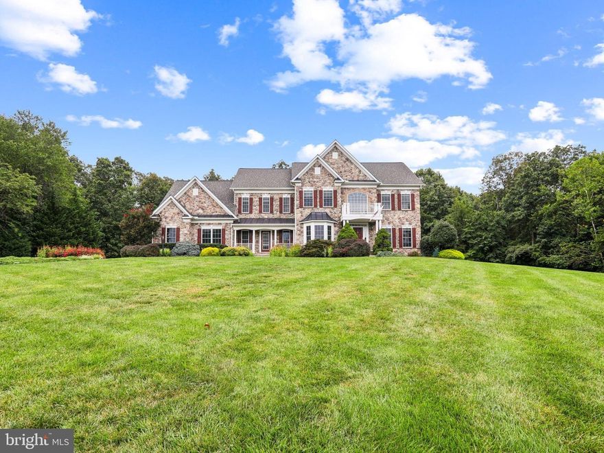 Private 3+ Acre Retreat in Chantilly – 5BR/5BA Executive Home Backing to 30 Acres of Protected Land. Discover the perfect blend of privacy, charm, and convenience in the Estates of Cedar Crest. Tucked away at the end of a quiet cul-de-sac, this stunning 5-bedroom, 5-bath executive residence sits on 3+ acres and backs to 30 acres of protected Dawson’s Corner parkland—a rare opportunity to own one of the community’s most desirable lots. All just minutes from Dulles Airport, Stone Springs Hospital, shopping, dining, and major commuter routes. Designed with versatility in mind, the main level in-law suite features a spacious bedroom, sitting area, and full bath—ideal for multi-generational living or extended guests. The heart of the home is the gourmet kitchen, boasting a large center island, quartz countertops, custom cabinetry, double ovens, stainless steel appliances, and large walk-in pantry. Enjoy casual meals in the sunny morning room, relax in the enclosed three-season room, or gather in the dramatic two-story family room with a cozy fireplace. Additional main-level highlights include upgraded flooring, a mudroom, and formal dining room perfect for entertaining. Upstairs, retreat to the luxurious primary suite with dual custom closets, private sitting area, and spa-inspired bath. Three additional bedrooms and two full baths—including a Jack & Jill—complete the upper level. The finished walkout lower level offers endless possibilities, featuring a spacious recreation room with fireplace, a large bonus room, and full bath—perfect for a home theater, gym, or game room. Step outside to your own private outdoor sanctuary with no rear neighbors, professional landscaping, irrigation system, and room for a future pool. A charming front porch, 3-car garage with extended driveway, and recent updates—including a new roof (2021) and HVAC (main level under 5 years)—add peace of mind. Enjoy all that the Estates of Cedar Crest offers, including large 3+ acre lots, walking trails, and easy access to shopping, dining, and major commuter routes. Don’t miss this rare chance to own a private oasis with unmatched space and convenience. Schedule your private showing today!