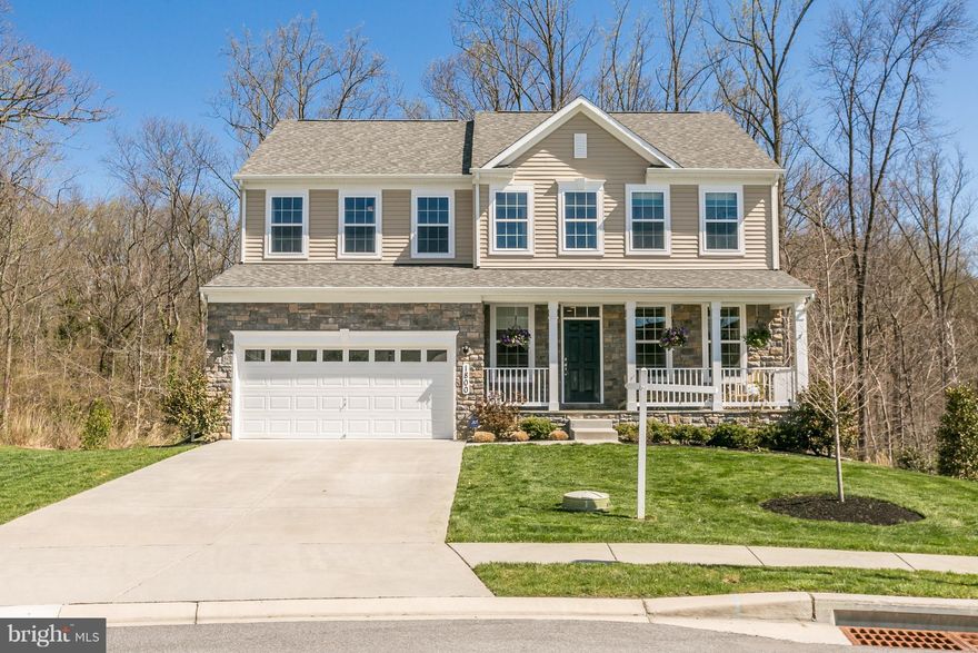 Shows like a model & is located on a premium lot on a cul-de-sac near State Park.Flat yard leads to conservation area & a stream behind property. Gourmet kitchen w/upgraded cabinets/granite/appliances,sunroom extension, wood floors 1st floor,spacious living spaces w/loads of windows for natural light,gas fireplace,finished lower level recreation area w/bedroom & bath. Great for entertainig! WOW