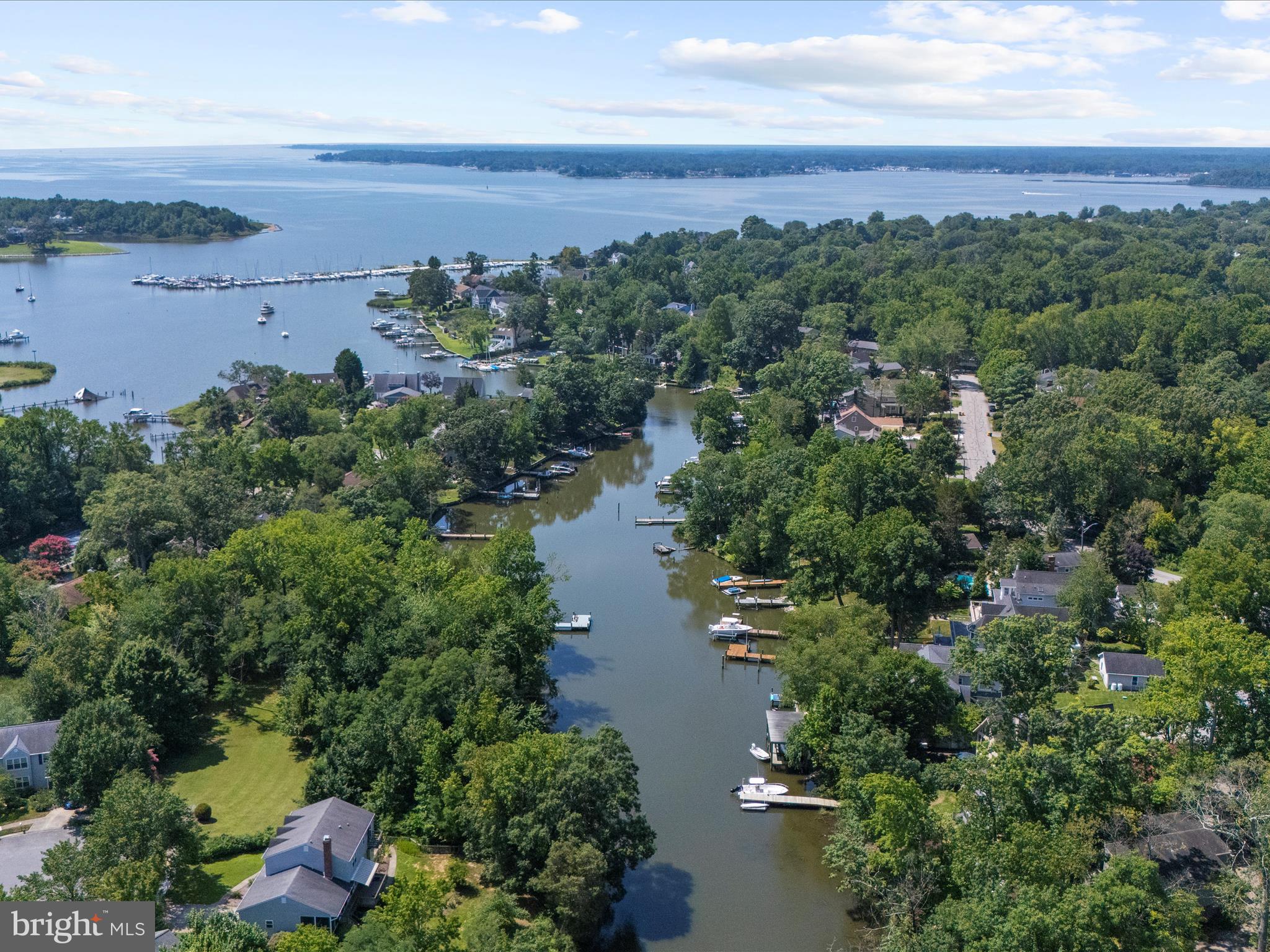 Open House 8/2 11:30-1:30P
Waterfront Wednesday , 8/6, Open House 4-6pm!
Tucked at the end of a quiet cul-de-sac, this stylish home offers a private pier for your boat plus a floating dock for kayaks, paddleboards, and crabbing—the ideal setup for embracing the waterfront lifestyle. From cozy evenings around the firepit to vibrant gatherings on the two-tier Trex deck, this home is a true haven for effortless entertaining and unforgettable moments.
Designed for both comfort and style, the home features soaring vaulted ceilings, a spacious dining area with water views, bamboo flooring throughout, skylights, recessed LED lighting, and ceiling fans in nearly every room. Modern upgrades include a 220V EV charging station, two-zone smart thermostats with remote sensors, a Renai tankless water heater, and a new Hague water treatment system.
Freshly painted and move-in ready, the main level includes two bedrooms, a den with water views, a laundry room, a pellet stove, a full bath, and a half bath. Upstairs offers two additional bedrooms, another full and half bath, plus a versatile loft space. There is also a walk-up attic off the upper level that is insulated and has a platformed area for another future office/workshop or storage. Two generous family rooms—one on each level—offer peaceful water views and flexible living or entertaining space. The gourmet kitchen features sleek countertops with bar seating, stainless steel appliances, and a gas cooktop.
Step outside to your private pier and floating dock—perfect for boating, kayaking, paddleboarding, crabbing, and other water adventures. The thoughtfully designed outdoor space also includes a side walkway leading to a tranquil firepit lounge nestled among blooming Crepe Myrtles, while programmable exterior lighting enhances the evening ambiance. Additional features include cedar siding, gutter guards, an encapsulated attic and crawlspace, and a new front door. As a bonus, the property has the paperwork for a future dredging project. Discover the large conditioned and encapsulated storage room under the main living area—accessed via the crawl space under the deck. Once in the crawl space, look left for the bolted door. Walk in and you will see the light switch overhead.
Hillsmere Shores residents enjoy access to a private beach, marina, community pool, and close proximity to downtown Annapolis. This rare waterfront retreat offers the perfect blend of smart living, natural beauty, and relaxed elegance.
Water Locations provided for info purposes only. Main Marina Located at 133C Bay View Drive East, with 109 slips of varying sizes, including 16 lift slips, and a small beach for launching of kayaks, Stand Up Paddleboards, and other small craft. Beach Drive Boat Ramp Located at 609 Beach Drive, with a 10-foot wide boat ramp , 6 boat slips, and 54 kayak racks. Sunset Drive Boat Ramp Located at 143 Bay View Drive East, with a 20-foot wide boat ramp, 9 boat slips, and 26 kayak racks. Beach Drive Kayak Ramp Located at 541 Beach Drive, with 52 kayak racks and a launching dock. Boat Park Located at 614 Beach Drive, for the storage of up to 48 boat trailers and boats. Beach Amenities & Updates: Sandy beachfront Newly improved footpath Pavilions with picnic tables Grills Multiple playgrounds Swimming area with nettle protection (when needed) Volleyball court Outdoor shower/rinse station Benches Rain gardens Plenty of open, grassy space. Little Free Library.Buyers responsible to verify all information above. Community Pool:100 Phipps Ln, Annapolis, MD 21403