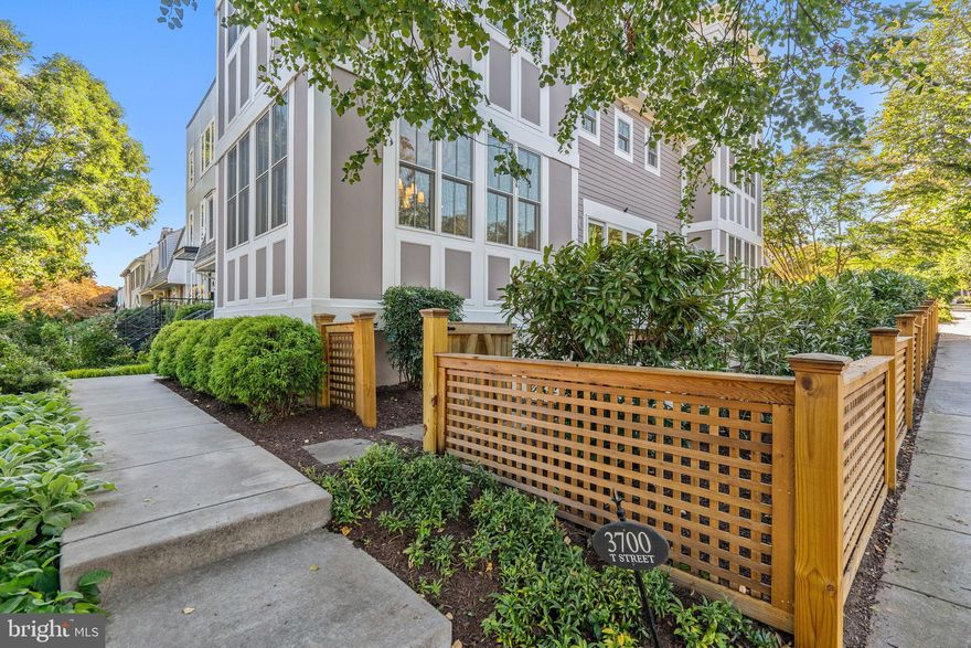 Live life ELEVATED at this commanding corner, perched above Georgetown in “best-kept secret” Burleith! Masterfully transformed top to bottom in 2017 for easy entertaining with palatial proportions! Wrap-around gardens envelop dramatic East and West corner bays and soaring new roofline at this tremendous dream home.  Giant roof deck with stunning views spanning the treetops from National Cathedral and across the Potomac - schedule your stargazing and fireworks party now! Private owner’s penthouse level w/ full bath suitable for a spa, plus bonus home office or exercise room; 2nd-flr delivers 3 more bedrooms w/ Elfa-system closets, 2 full baths and laundry center. Main level flows sweetly across 1,000 SF of gleaming wide-plank flooring anchored by stunning pro-grade kitchen overlooking side porch and book-ended by huge front dining & rear living rooms. Lower lvl offers in-law or au pair suite with kitchenette to welcome short- or long-term guests. Parking for 2 in rear driveway, plus bike storage in the shed.  Why pay Georgetown prices when you can have it ALL in this PALATIAL corner perch?

Contact us for a safe & private showing