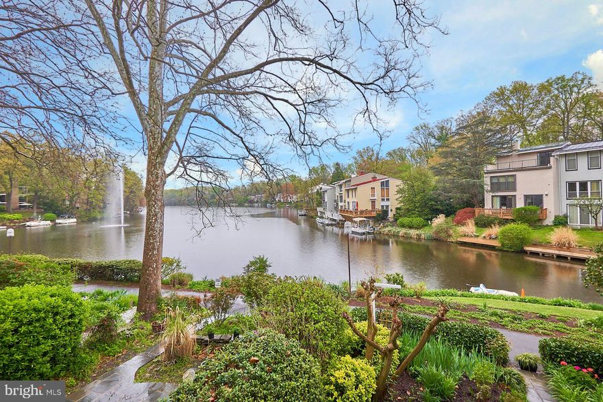 Welcome home to the best of Reston lakefront living.   This home is for the sophisticated  buyer looking for something special.   Totally reconstructed on all three levels and renovated top to bottom this home offers million dollar views the entire length of Lake Anne and the fountain.   All interior walls were removed on the mail level to open up the space and expose the stunning lake views and the kitchen repositioned with large center island and Chef grade appliances.  Stunning reclaimed barn wood floors throughout the  main level.  The upstairs bedroom level was reimagined  with original bedroom #3 incorporated into a luxurious full width master bedroom suite with expanded luxury bath and tons of closets.   The lower level was redesigned and space was taken from the large utility storage room to create a lovely private office/den/ library with new wet bar off the family room.   New doors and windows throughout out, new roof.  Thousands in landscaping and hardscaping with enclosed private front courtyard garden and a second patio garden on the  lake.  The location is fabulous and as good as it gets - walk to Lake Anne Plaza, the farmers market, restaurants, concerts and more.  Walk to pools, tennis and Hidden Creek Country Club.  It is a short ten minute walk to Reston Town Center, commuter bus stops at the corner for car less commuting to local shopping center, amenities and the metro station at Wiehle Ave.  Please note this house was originally built as 3 bedrooms upstairs.  A previous owner converted to two bedrooms to form two master suites.  Owners will  consider putting the wall back in place for a buyer wanting three full bedrooms upstairs! Floorplan is available in documents.  AC is RELAC - call lister for more information.