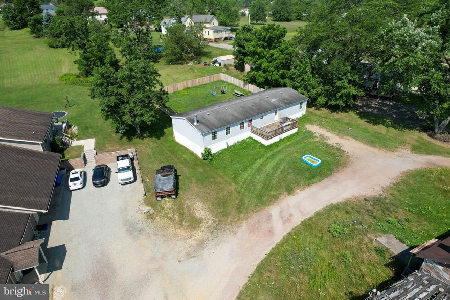 Looking for Home Sweet Home in Somerset close to the Laurel Highlands with access to hiking, biking, hunting, fishing and skiing? This is a 4 bedroom and 2.5 bath home situated on a flat parcel with large fenced in yard. Just little under an acre. Large master bathroom includes a shower and garden tub. Spacious living areas for gatherings. Somerset Area School District and walking distance to the High School. Huge barn included make it your own!