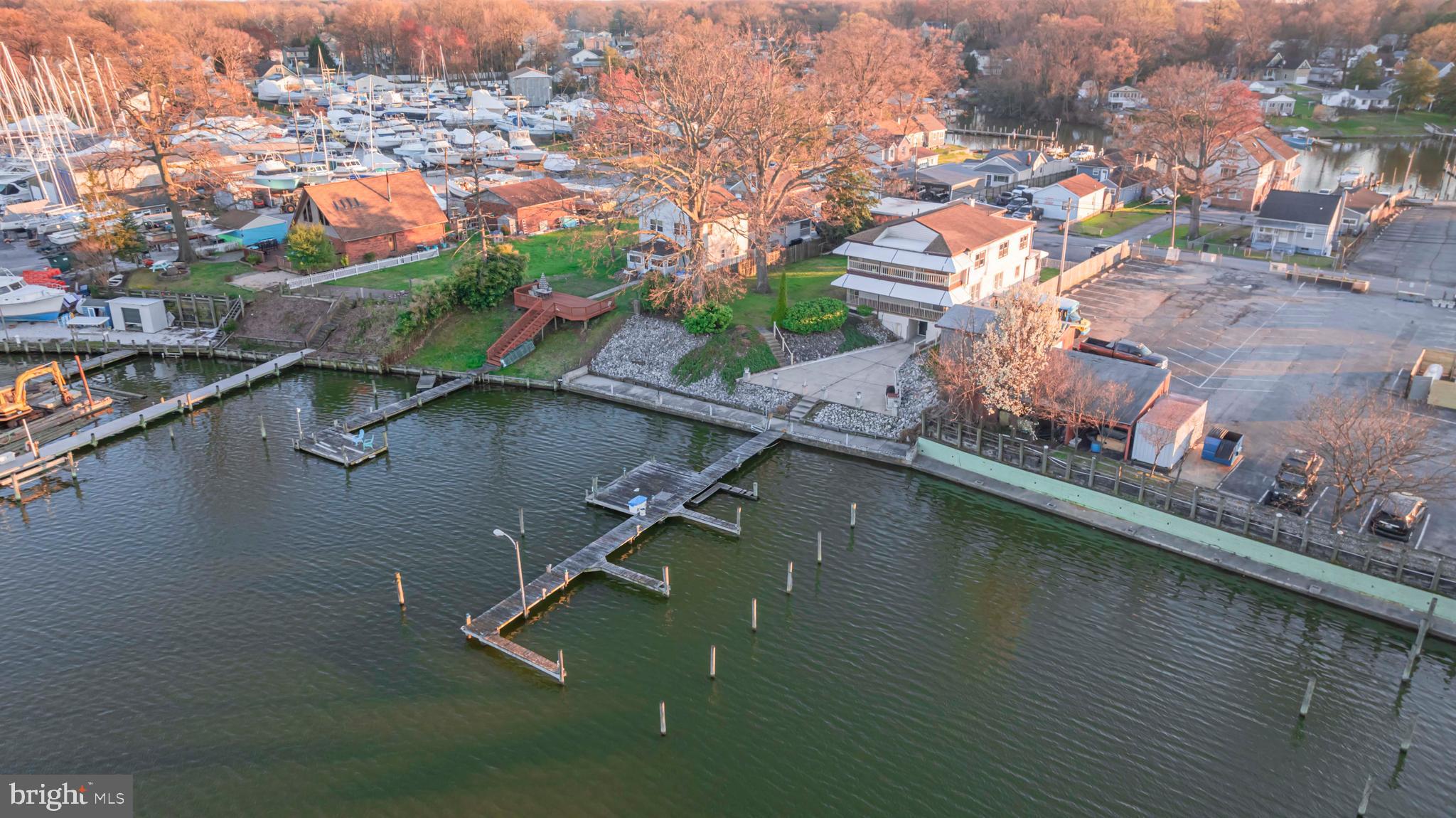 Discover the perfect blend of residential charm and commercial opportunity with this exceptional property, boasting an expansive 3,044 square foot multi-unit house nestled on a generous 0.4-acre waterfront plot. With its private pier and multiple deep-water slips, this property promises an unparalleled waterfront lifestyle or a thriving business venture. Situated on 0.4 acres of premium waterfront land, the property offers breathtaking views and direct access to Hopkins Creek and all that the Chesapeake Bay has to offer.
The main dwelling is ingeniously divided into two separate units, each featuring 2 bedrooms and 1 full bath, offering flexibility for families, guests, or tenants. Additionally, a potential third studio unit on the lower level provides further opportunities for customization or rental income. A detached, temperature-controlled 2-story garage with multiple bays presents a rare find for hobbyists, collectors, or commercial operations, ensuring ample space for projects, storage, or business needs.
Unique to this property is its commercial zoning, which has historically enabled both residential tranquility and lucrative commercial endeavors. The possibilities are as vast as your vision, from waterfront hospitality ventures to serene living quarters combined with a niche business operation. Nestled next to two popular restaurants, multiple marinas, and a private waterfront club, the location offers an ideal mix of tranquility and convenience, making it a highly desirable spot for both living and commerce. Whether you're seeking a picturesque home, a profitable rental property, or a base for your business, this property's versatile potential makes it an outstanding investment in today's market.