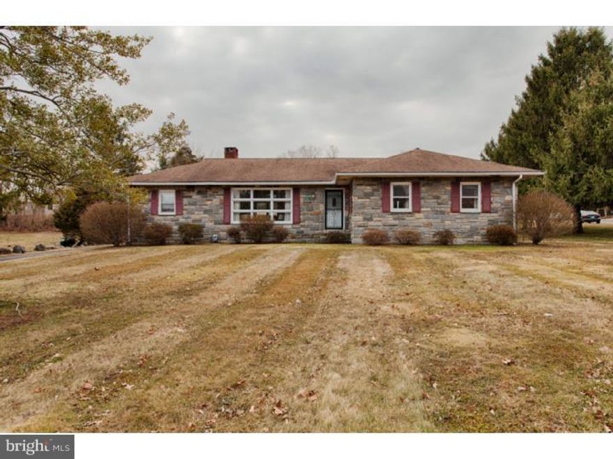 Old world quality craftsmanship abounds in this wonderful custom built ranch home on a  great  level lot Plenty of yard for playing those sports games  when having those summer cookouts.   No siding on this home...just solid stone and brick all the way around !!    As you enter you first notice the gleaming hardwood floors that run throughout the home.   The living room is large with great natural light from the large picture window.   The living room flows into the dining room , which features a great stone fireplace.   On to the large eat in kitchen , which will accommodate any large family gathering .   Many solid wood cabinets  adorn the kitchen with  loads of counter space.   There are 3 bedrooms, one a master with its'  own full bath.   There is then an additional hall bath.  No problems with storage...especially when you have a walk up attic!   And for more possibilities of this great home, check out the huge dry basement with an outside exit!!  .  The owner just installed a complete perimeter  drain system with 2 new sump pumps., which carries a TRANSFERRABLE WARRANTY.   This is a huge space waiting for your finishing touches. This owner always kept the mechanical systems up to date.   They  heating system was converted to gas and installed a new boiler in 2002.   They also installed new central air in 2013.   The 1 car attached garage also offers addition "loft area " storage.   There is plenty of space if someone wanted to expand this home.   This is a solid home offered by the original owner.  The home is in move in condition.  With a few updates this home will be a treasure !!