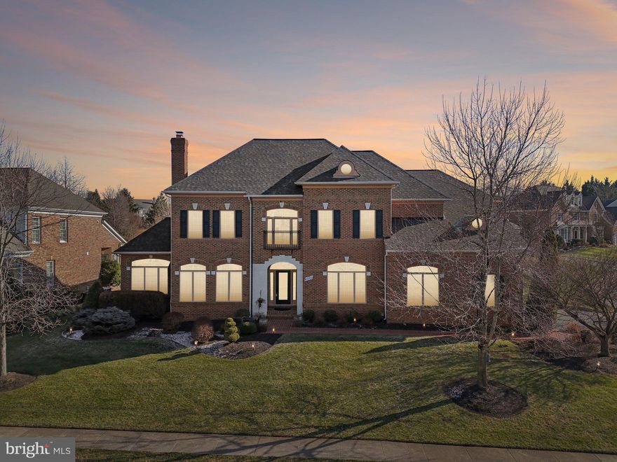 Discover the epitome of refined living in this stately residence nestled within the gated, prestigious Lake Manassas community in Gainesville, VA—a haven of privacy, exclusivity, and country-club elegance surrounding a pristine 600+ acre protected reservoir. Perfectly positioned for  buyers seeking a seamless blend of luxury, convenience, and access to Virginia's finest amenities.

Step into timeless architecture with a grand two-story foyer featuring dual staircases and elegant archways. The main level boasts versatile spaces: a formal living room with wood-burning fireplace, gracious dining room for hosting, and a light-filled conservatory-style sitting room for serene retreats. The heart of the home is the soaring two-story family room, framed by expansive windows, a gas fireplace, and custom built-in shelving. Adjacent, the gourmet kitchen shines with granite countertops, recessed lighting, and 2020 KitchenAid stainless appliances—including a double convection wall oven with air-fry, convection microwave, five-burner gas cooktop, bar-style island, dedicated desk/coffee areas, and casual dining space. French doors open to the rear, while abundant natural light and ceiling fans enhance flow. Complete with an updated powder room, main-level laundry, private office behind glass French doors, and a new roof installed in 2022 for added peace of mind.

Upstairs, the luxurious primary suite serves as a true sanctuary, featuring a tray ceiling, ceiling fan, gas fireplace, double French doors, private sitting area with deck access, generous walk-in closet, and spa-inspired bath with jetted soaking tub, large separate shower, dual vanities, and private water closet. One secondary bedroom offers an en-suite bath; the third and fourth share a well-appointed Jack-and-Jill. The upper landing overlooks the dramatic living areas below, reinforcing the home's open and airy design.

Inside the gates, enjoy resort-style amenities: swim & tennis center with outdoor pool, 3 tennis courts, 3 pickleball courts, 2 basketball courts, tot lot, and scenic bike/walking trails. Direct gated access to Stonewall Shopping Center means errands without leaving the community. Adjacency to Stonewall Golf Club provides stunning lakeside views, clubhouse dining, and events—evoking a true country-club lifestyle.

Beyond the gates, embrace unparalleled convenience and adventure. Just 35 miles from Washington, DC (40-60 min drive via I-66, or VRE train), indulge in National Mall monuments, free Smithsonian museums, seasonal events like cherry blossoms, and vibrant dining in Georgetown or Dupont Circle. For weekend escapes, Charlottesville is 81-84 miles south (1.5 hrs via US-29)—gateway to UVA's UNESCO-listed campus, Monticello's historic tours, the acclaimed Monticello Wine Trail (40+ wineries like King Family, Veritas, Pippin Hill; named 2023 Wine Region of the Year), and Blue Ridge/Shenandoah hikes (Old Rag, Skyline Drive overlooks, fall foliage).

Entertainment thrives nearby: Jiffy Lube Live amphitheater (8-10 miles south in Bristow) hosts big-name concerts (25k capacity, lawn seating, tailgating) from rock to country—easy access without DC hassles. Immerse in Virginia's horse country: 20-25 miles to Great Meadow in The Plains for legendary steeplechase events like the Virginia Gold Cup and International Gold Cup—think thrilling races, terrier contests, elaborate tailgates amid rolling hills, polo, and equestrian culture.

Outdoor depth abounds: Whitney State Forest offers horseback riding and trails; nearby natural preserves and battlefield hikes. Retail/dining at Virginia Gateway and Stonewall (minutes away) provide everyday essentials.

Lake Manassas delivers gated privacy with amenity-rich living, without sacrificing proximity to urban culture, mountain/wine getaways, concerts, and horse events. Ideal for those craving a balanced, elevated lifestyle. Schedule your private tour today!