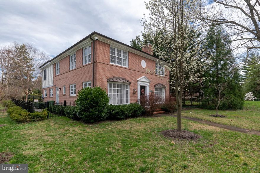 This Guilford home is in the Roland Park school district, a five-minute walk to Sherwood Gardens, and a ten-minute walk to the Johns Hopkins Homewood and the Loyola University campuses!  Spacious and light-filled, this lovely house features an open floorplan and numerous upgrades, including a new slate roof in 2010.  On the first floor, a sunken living room with wood-burning fireplace and beautiful hardwood floors opens to another gathering room that the current owners use as a great room/family room but could also be a separate formal dining room.  At the rear of the house, the huge gourmet kitchen with granite countertops, stainless steel appliances and a cooking island is open to a large dining area and family room.  From the family room, sliding doors lead to a fenced yard with bluestone patio overlooking mature landscaping and a parking pad for three cars.  A large half bath is off of the family room.  An extra-wide staircase leads to the second floor, which features four bedrooms and three full baths.  The two bedrooms and bath at the rear of the house were part of an addition and have their own heat pump.  At the front of the house are two separate master suites, each with an en suite bathroom.  The front bedrooms are hardwood, the rear bedrooms are carpeted.  These rooms are huge! This house is just what you are looking for.  Perfectly scaled, with large open spaces.   Move right in!   The photos and video tell the story. https://properties.myhouselens.com/mls/20440