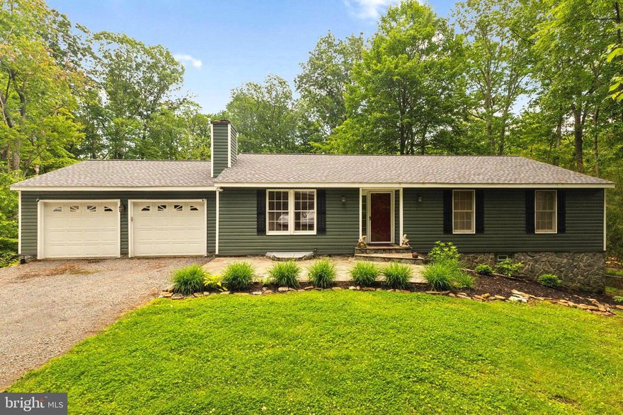 Welcome to your own PRIVATE Mountain Retreat! WONDERFUL Home located at the END of the ROAD on Bull Run Mountain * Incredibly SECLUDED Setting through your own Gated Entry * Enjoy 2.5 Acres of MATURE TREES perfectly combined with plenty of OPEN GRASSY Space & a Natural Stream too * NEWER Roof (2021), Vinyl Siding & Stone Foundation (2022) * LARGE Living Room with Wood Burning Fireplace * HUGE Eat-in Kitchen offers RUSTIC Charm along with MODERN Accents * PRETTY Solid Wood Cabinetry, Embossed Copper-look Backsplash, Under & Over Cabinet Lighting as well as AMPLE Work & Storage Space * Slider opens to ENORMOUS Covered Deck with Built-in Grill & Cleaning Station * Steps lead down to a STONE Patio with a Firepit & the BEAUTIFUL Fenced Rear Yard surrounded by TREES * UPDATED Full Bath in Hallway on Main Level * GREAT Rec Room for Entertaining with CUSTOM “Harley” Bar, Tile Flooring, Media Area with Projector & Pull-down Screen as well as slider to Walk-out Level Exit * Decked out Gym with Rubber Flooring, Mirrors, Punching Bag, Weights & MORE * Full Bath in Hallway * BIG Laundry/Storage Room with Washer, Dryer & SUPER HANDY Dog Washing Station * THREE Sheds, 2-Car Carport & OVERSIZED 2-Car Garage make Parking & Storage a Breeze * FIOS & Comcast/High Speed Internet available