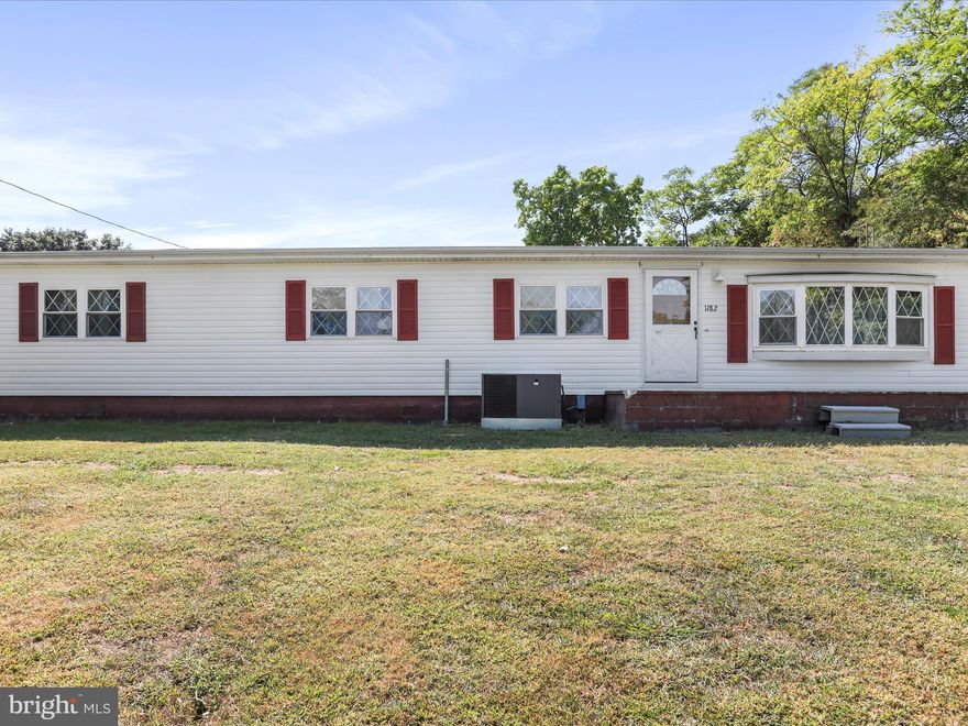 This manufactured home sits on a half of an acre.  The home has 4 bedrooms, 2 full bathrooms, living room, laundry, kitchen & dining room.  There is a primary suite with private bedroom and attached full bathroom.  There is also a large detached 4 car garage perfect for a personal shop to work on your cars.  In addition the yard is fully fenced making it the perfect spot for your pets.