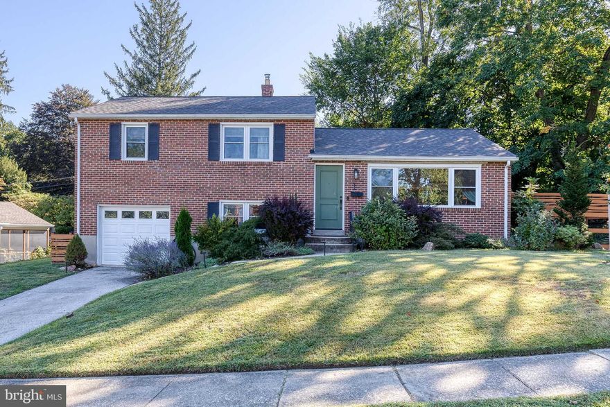 OFFER DEADLINE MONDAY SEPTEMBER 15TH BY NOON! Welcome home to this beautifully maintained 3-bedroom, 2-bathroom split-level single family nestled in the highly sought-after Rollingwood neighborhood of Catonsville. Surrounded by mature trees and wide, shady streets, this home offers both tranquility and convenience. Step inside to discover a thoughtfully updated interior that blends modern comforts with classic charm. The spacious living areas feature fresh updates, including a 2020 kitchen renovation with stylish finishes and high-end appliances and a casual breakfast bar. The large, open layout is perfect for both everyday living and entertaining, with bright natural light throughout!
Don't forget about a cozy bonus living room, great for an office or to snuggle up and watch a movie on the couch. You also have the convenience of a full laundry room and storage area with a walkout to the backyard patio, as well as an attached garage which allows for even more parking space on the long driveway or even more great storage options! The large bedrooms offer space and comfort, with gorgeous original hardwood floors. 
Outside on the custom built stone patio, relax in your fenced-in landscaped yard for a barbecue or for some solitude as the sun goes down after a busy day. 
Key features include: Primary Suite with En Suite Bathroom – Featuring stunning marble tile work, this recently renovated bathroom offers a spa-like retreat. Updated Kitchen (2020) – Sleek cabinetry, stainless steel appliances, and plenty of counter space for the home chef. Stone Patio (2021) – Ideal for outdoor entertaining, overlooking a serene and private backyard. New Carpet Downstairs (2019) – Cozy up in the lower-level family room with brand-new carpeting. Energy-Efficient Upgrades – New attic and crawl space insulation (2018) ensures year-round comfort and energy savings. Roof (2019), Gutters (2017), and Hot Water Heater (2016) – Major systems have been recently updated, providing peace of mind for years to come. Full Window Replacement (2016) – Enjoy abundant natural light and improved energy efficiency throughout. Hallway Bathroom Renovation (2016) – Beautifully updated with modern fixtures.

Set in a neighborhood with walkable access to the elementary and middle school, and close proximity to parks, walking trails, and equidistant from both downtown Catonsville and historic Ellicott City, you can't find a more convenient location for living.

Life is Great in 21228! Schedule a tour today!