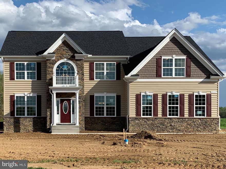 TO BE BUILT ** QBHI's Hampton with an A1 elevation. Photo shows upgraded elevation and sideload garage. This house will have a 2.5 car front load garage with a mudroom and built-in cubbies. Other upgrades include a 4 foot bumpout in the Family Room, a Sunroom, a maintenance-free deck, fully finished basement, Grand Kitchen and engineered hardwood floors. The community has tennis courts and playground, and will have a clubhouse and pool.