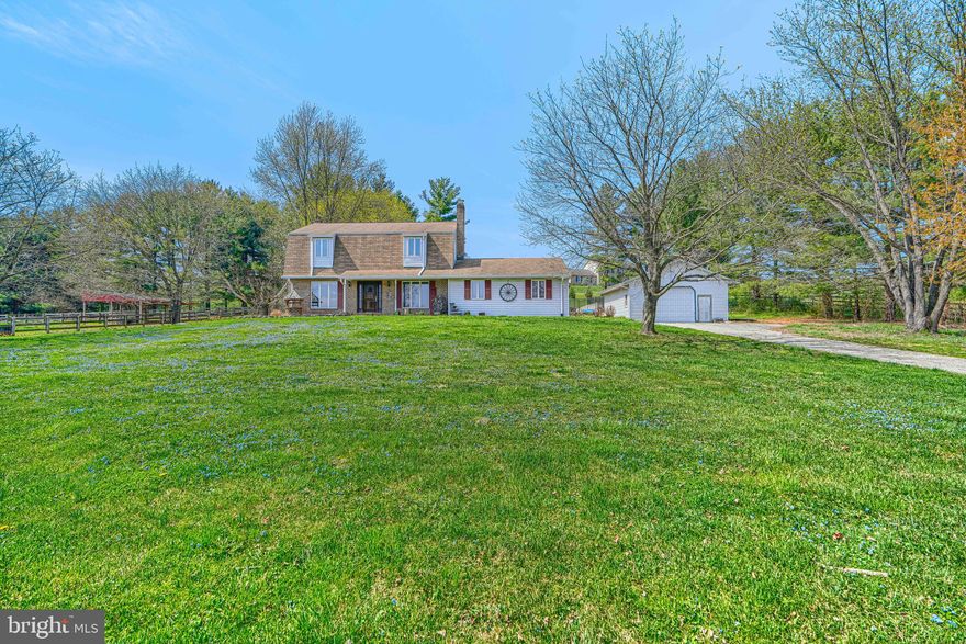 This exquisite Colonial-style residence, built in 1986, offers a harmonious blend of traditional charm and modern amenities, situated on a generous 5.45-acre corner lot in the desirable Uniontown subdivision. The exterior features a combination of brick and vinyl siding, complemented by beautifully landscaped grounds that provide both privacy and aesthetic appeal. Enjoy outdoor living with a spacious porch, perfect for entertaining or relaxing while overlooking the serene pasture views. Inside, the home boasts 1,960 square feet of thoughtfully designed living space. The traditional floor plan includes three well-appointed bedrooms and two and a half bathrooms, featuring both tub and stall shower options. The primary bath offers a tranquil retreat, while the spacious dining area creates an ideal setting for gatherings.  The country kitchen equipped with custom-made wood cabinets and appliances, is a perfect place for kitchen enthusiasts. Crown moldings and ceiling fans enhance the interior ambiance, while double-pane casement windows ensure energy efficiency and comfort. The fully finished basement, accessible via an interior stairway, provides additional living space and storage options, complete with an outside entrance. A cozy fireplace with glass doors and a mantel adds warmth to the living area, making it a perfect spot for relaxation. Additional highlights include a personal in-ground pool, secure storage options, and multiple garages-both attached and detached-offering ample parking and workspace. The property also features various outbuildings, including a barn and gazebo, enhancing its versatility for various uses. Experience the perfect blend of indoor comfort and expansive outdoor beauty in this inviting property. Schedule your showings today!